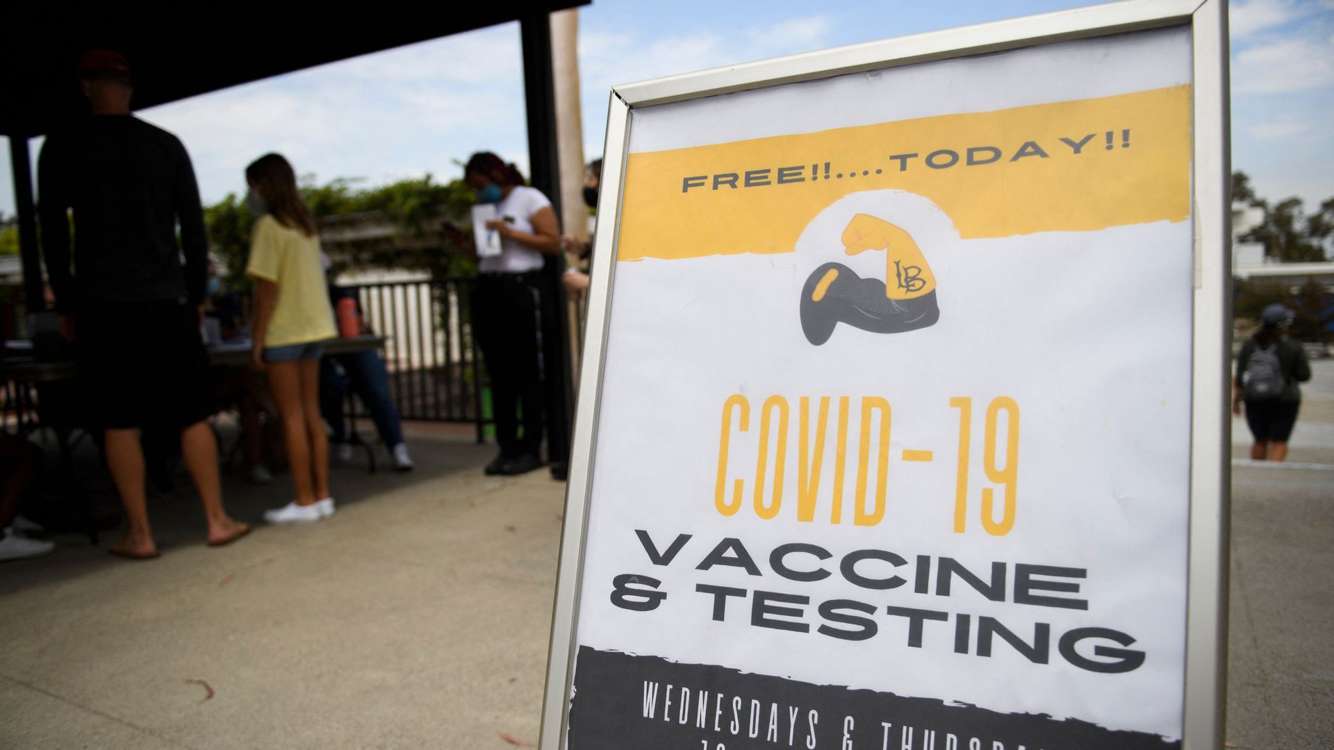 Photo of a sign that says "COVID-19 vaccine and testing"