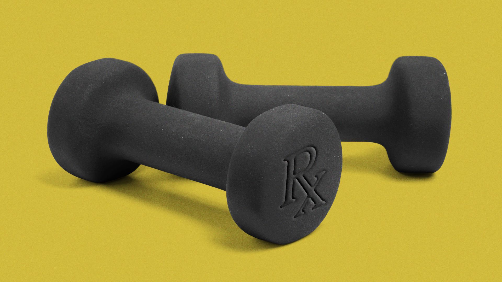 A set of hand weights with RX imprinted on one end.