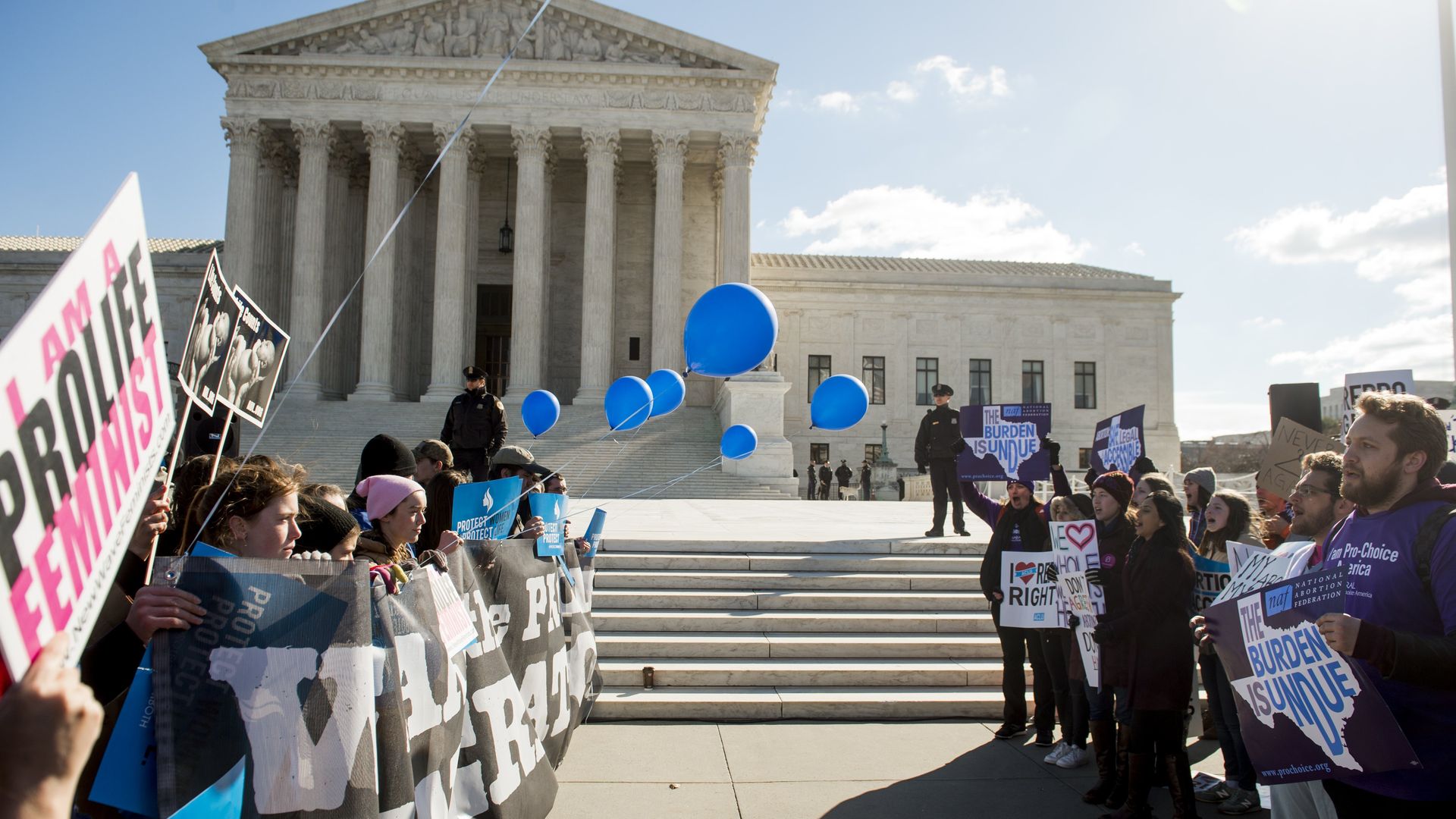 Supporters of legal access to abortion, as well as anti-abortion activists, rally outside the Supreme Court in Washington, DC. 