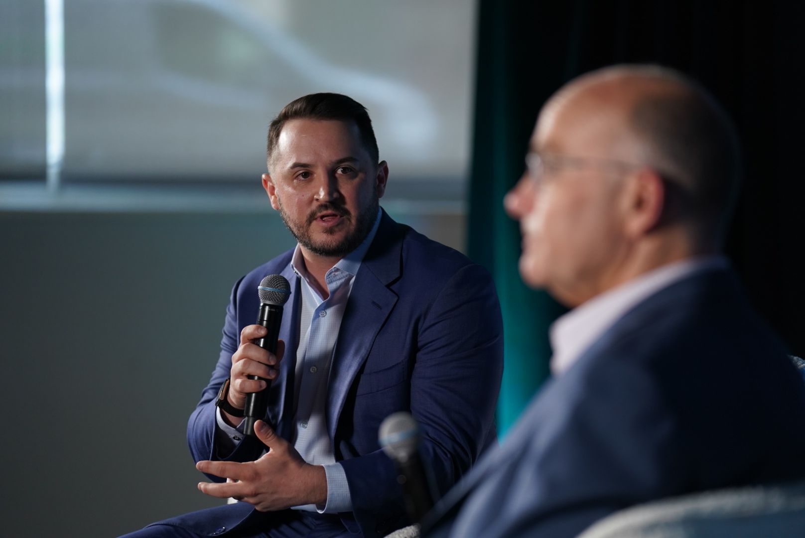 Taylor Budowich speaks with Mike Allen at an Axios event this morning.