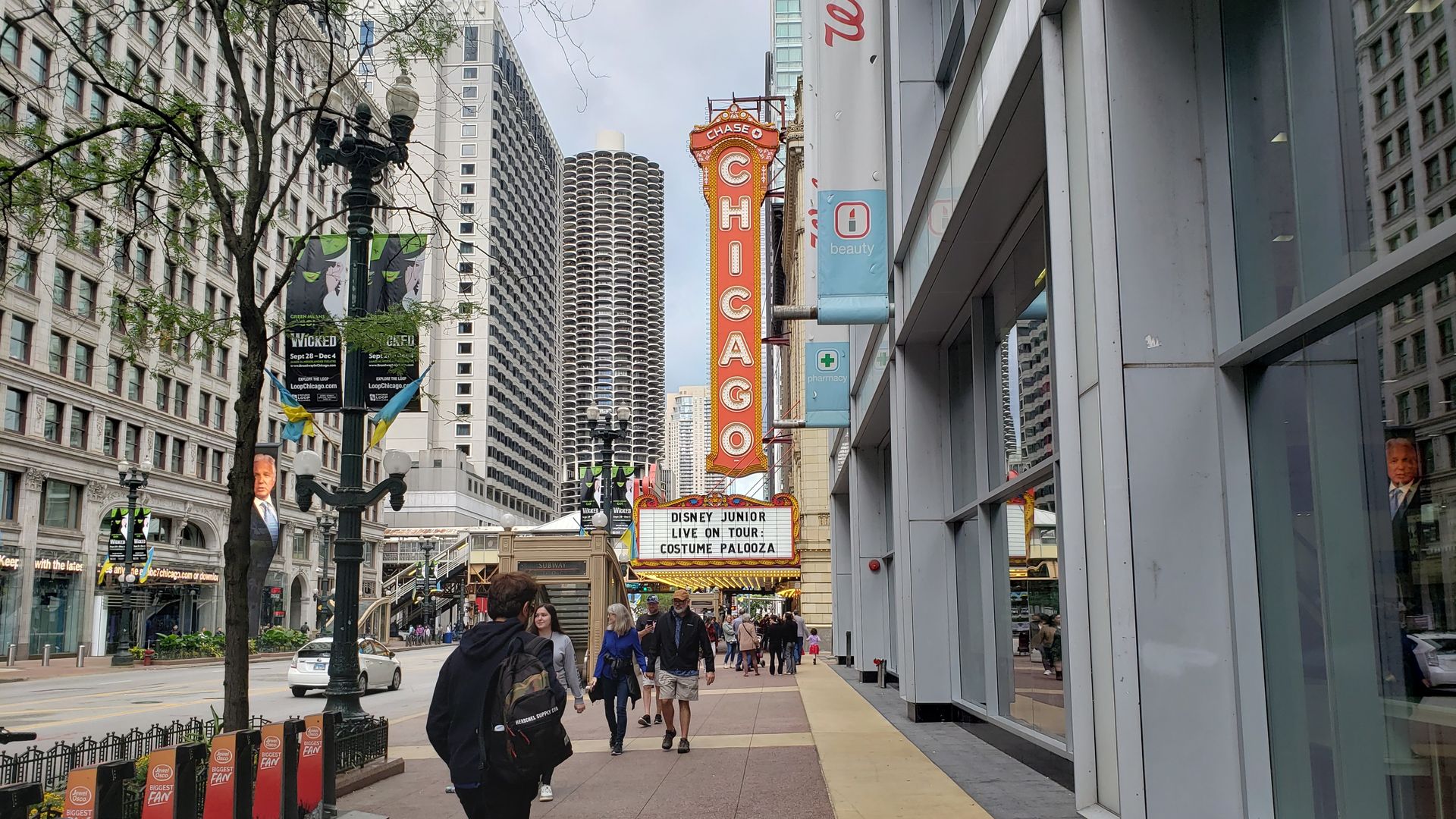 Photo of a street with a big sign that says "Chicago" 