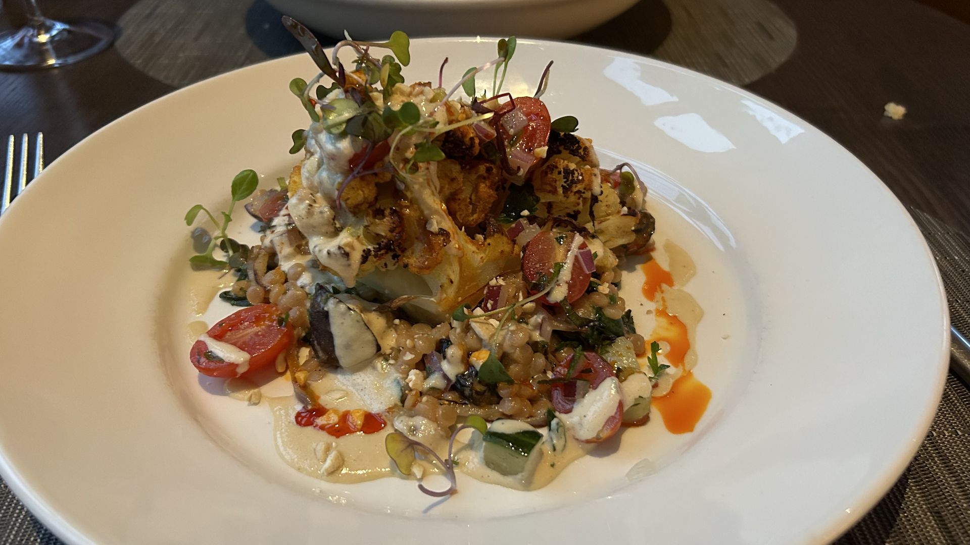 A plate of tandoori cauliflower on couscous