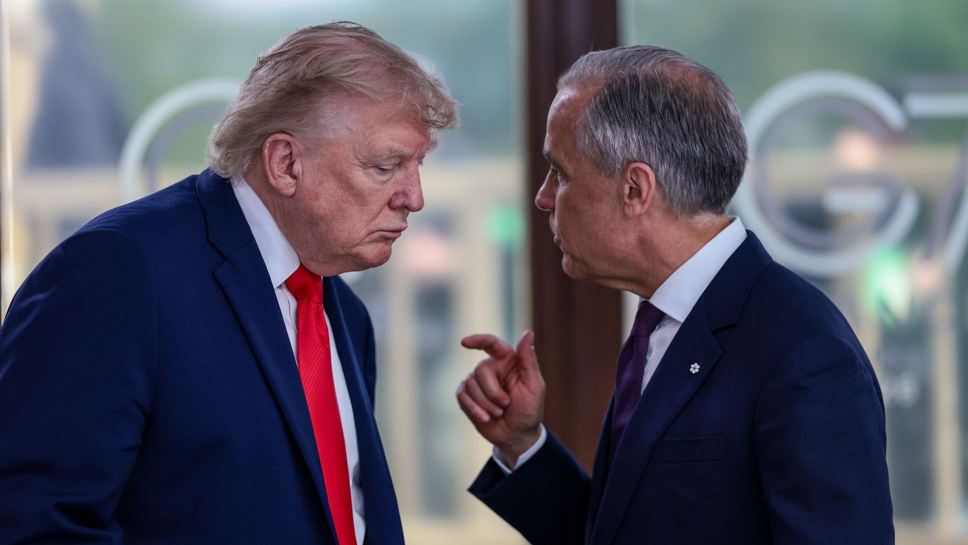President Trump speaks with Canadian Prime Minister Mark Carney at the G7 last month.