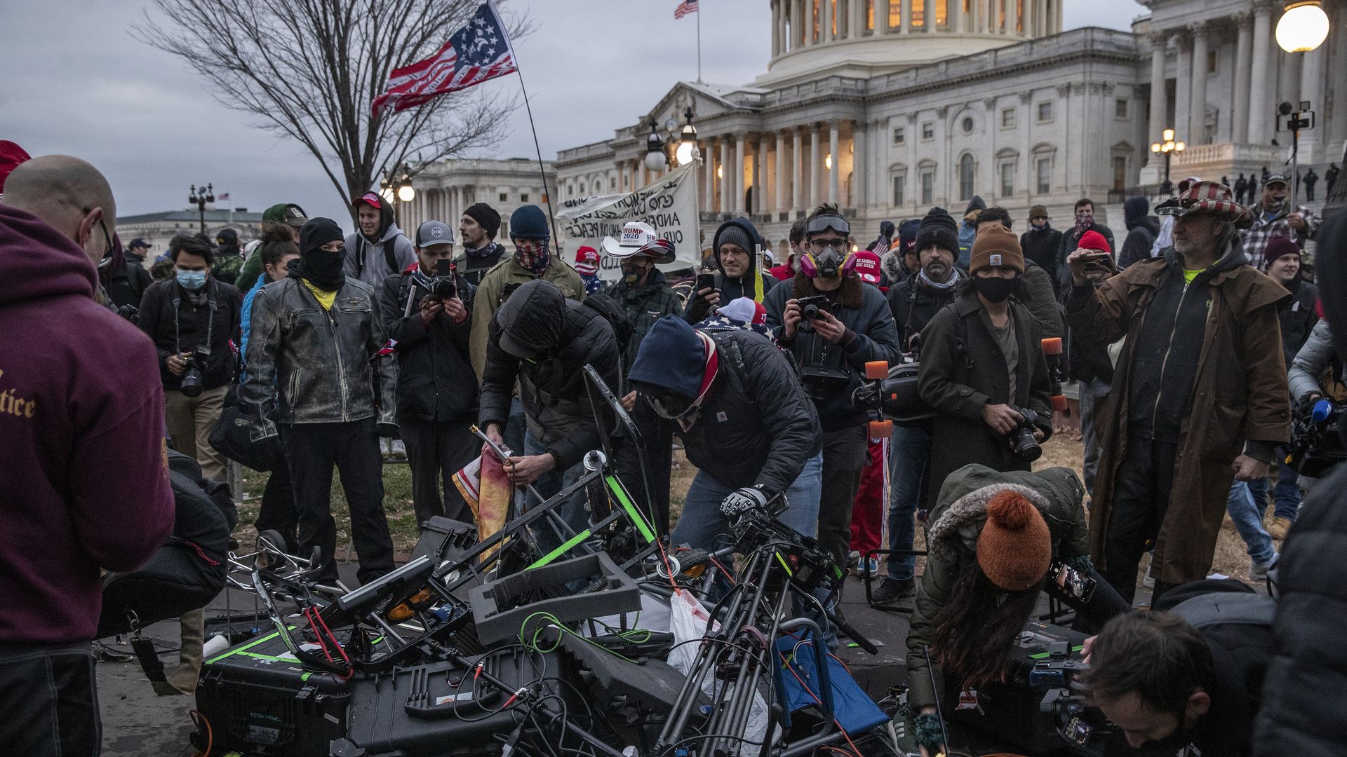 Rioters destroying broadcast equipment outside of the U.S. Capitol on Jan. 6, 2021.