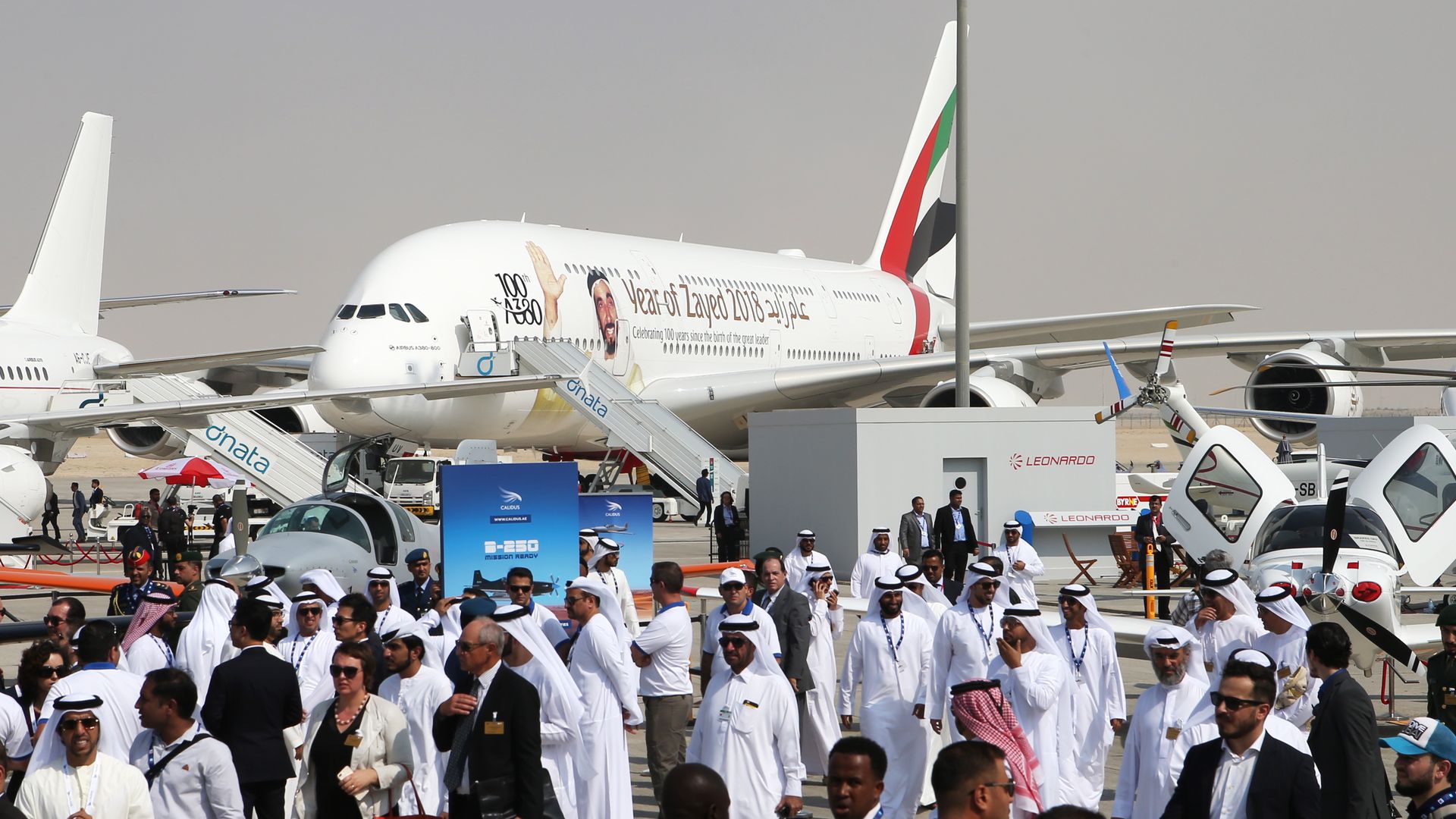A plane on crowded tarmac