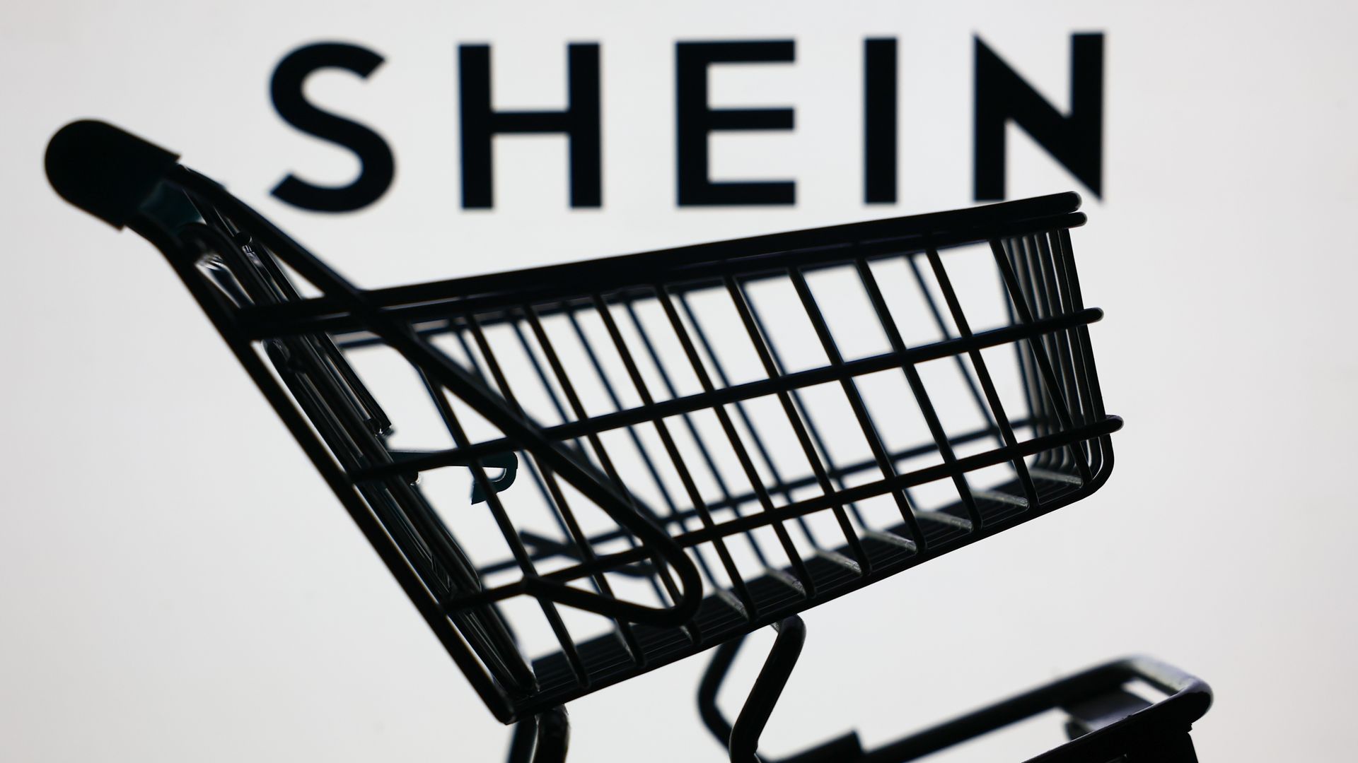 Shein logo on a screen and a small shopping cart are seen in this illustration photo taken in Krakow, Poland on June 8, 2025. 