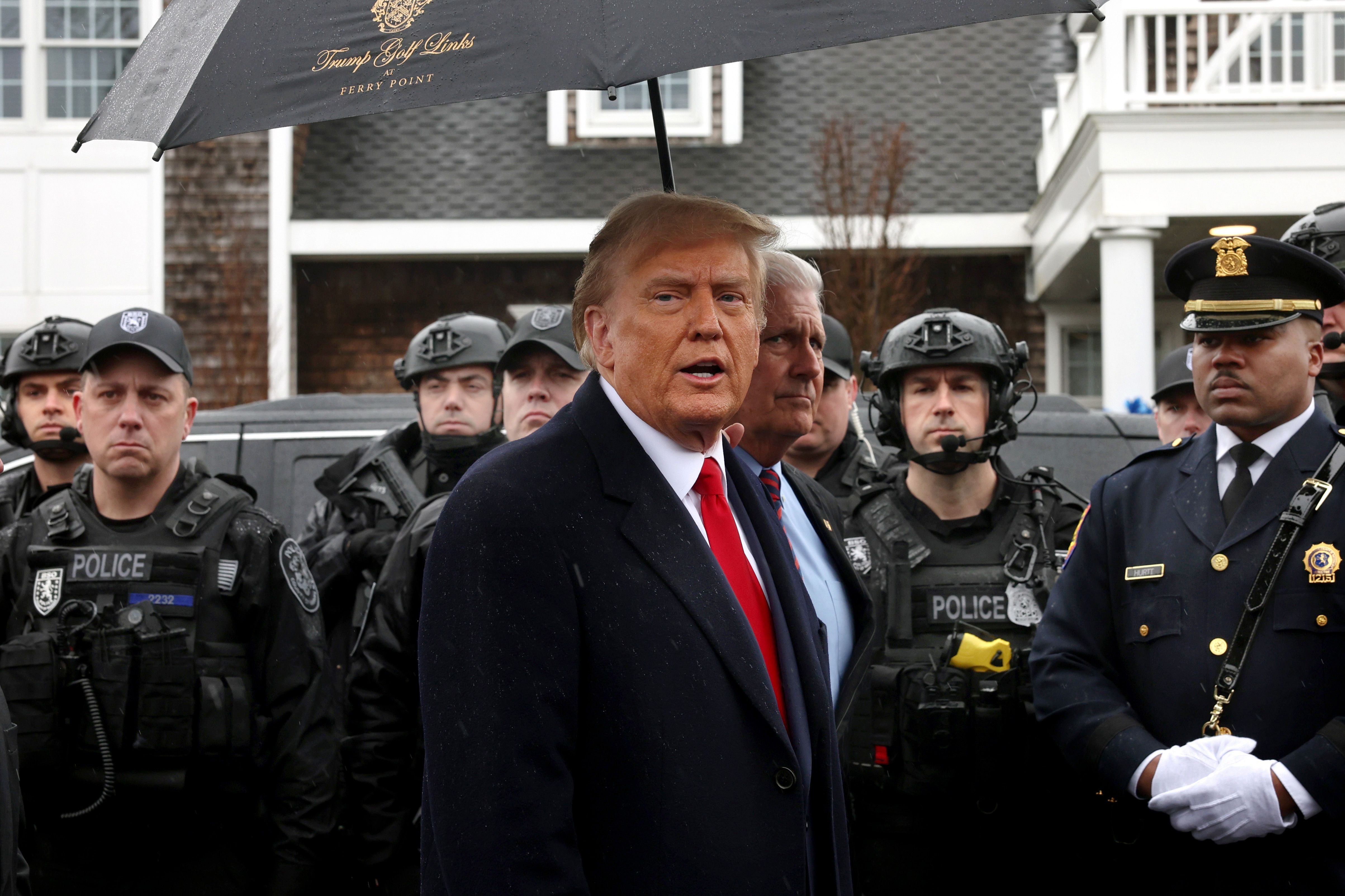 Former President Trump leaves yesterday's wake for slain NYPD officer Jonathan Diller in Massapequa, N.Y., on Long Island.