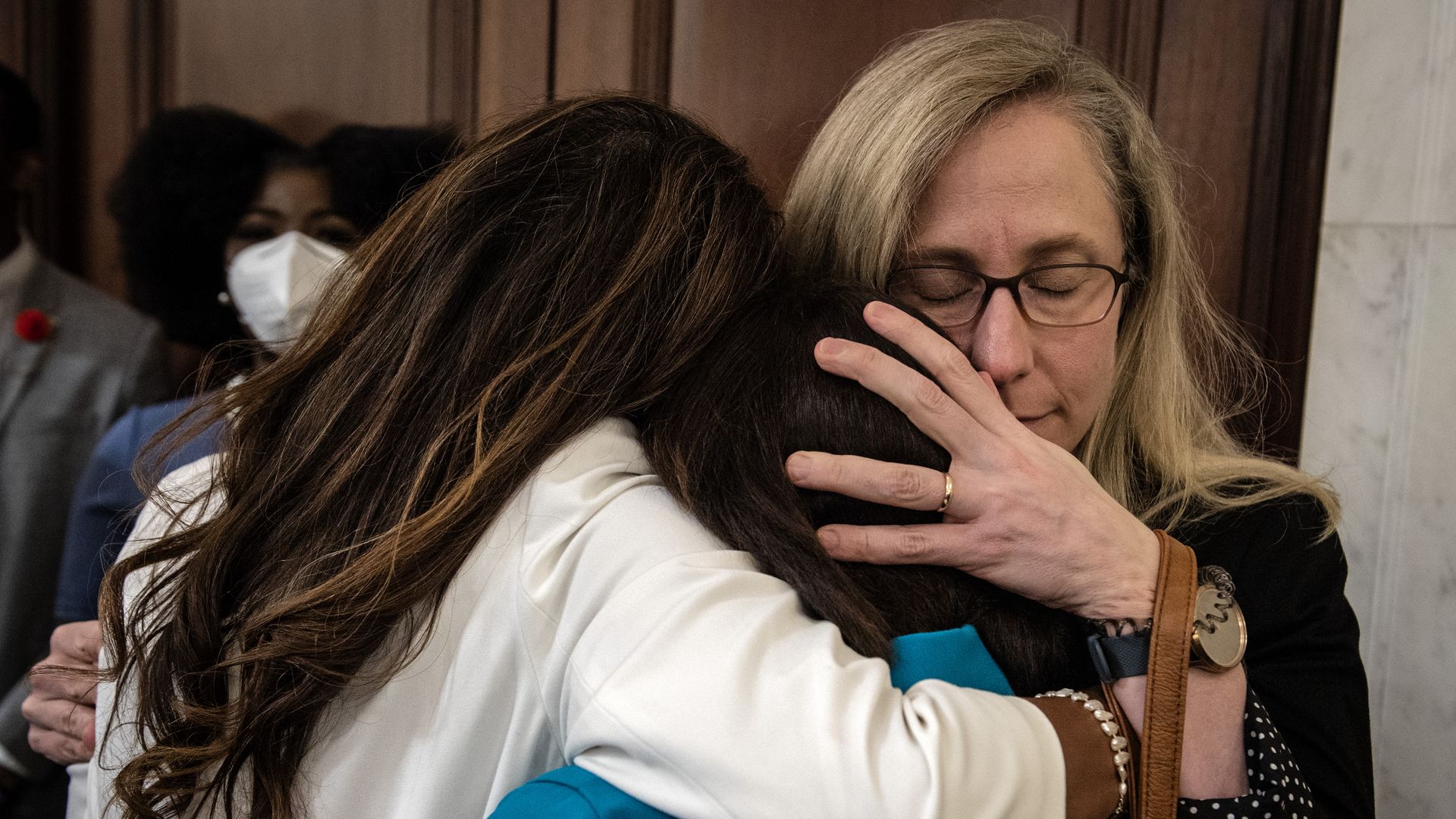 Rep. Abigail Spanberger is seen hugging fellow House members in July after a meeting of the Jan. 6 Select Committee.