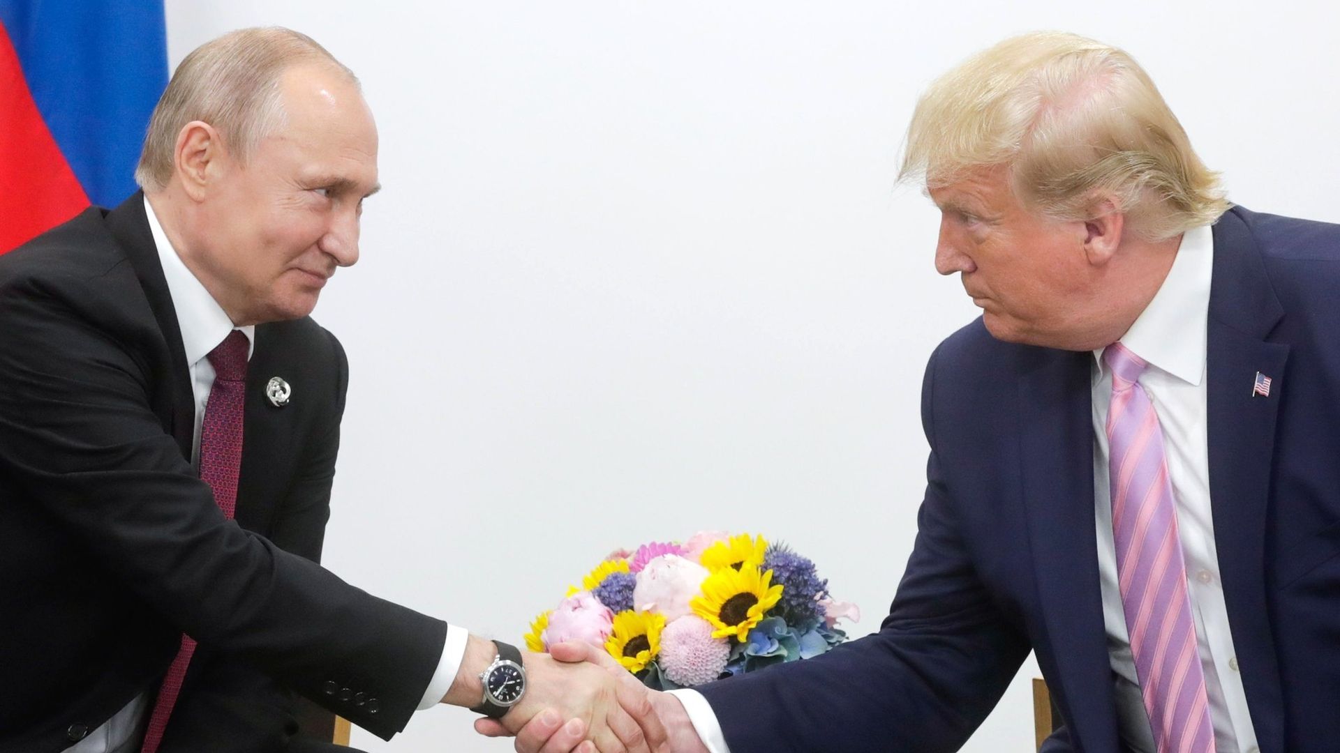 President Donald Trump (R) meets Russian President Vladimir Putin (L) on the first day of the G20 summit in Osaka, Japan on June 28