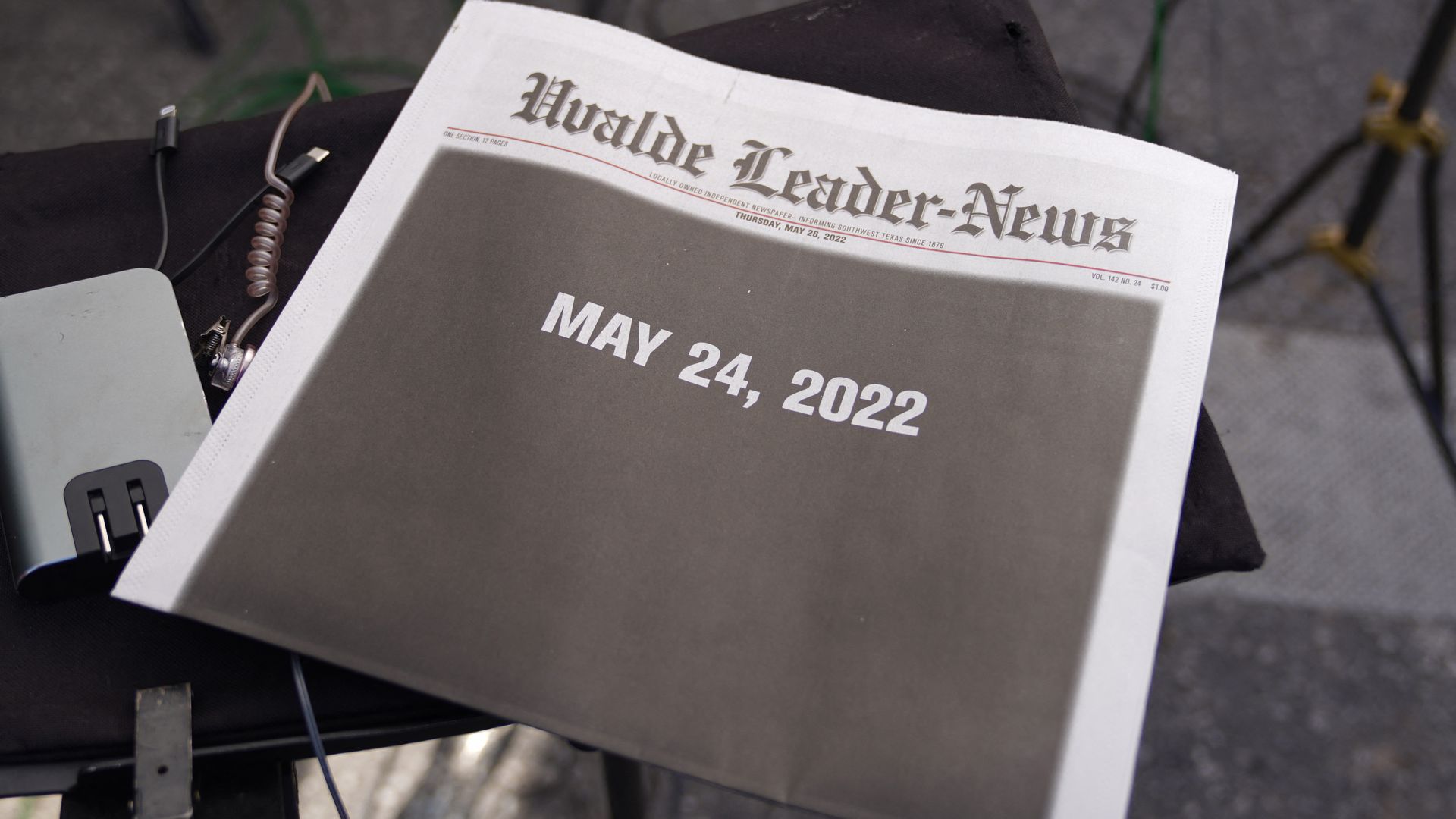 The front page of the Uvalde newspaper shows a solid black background instead of stories.