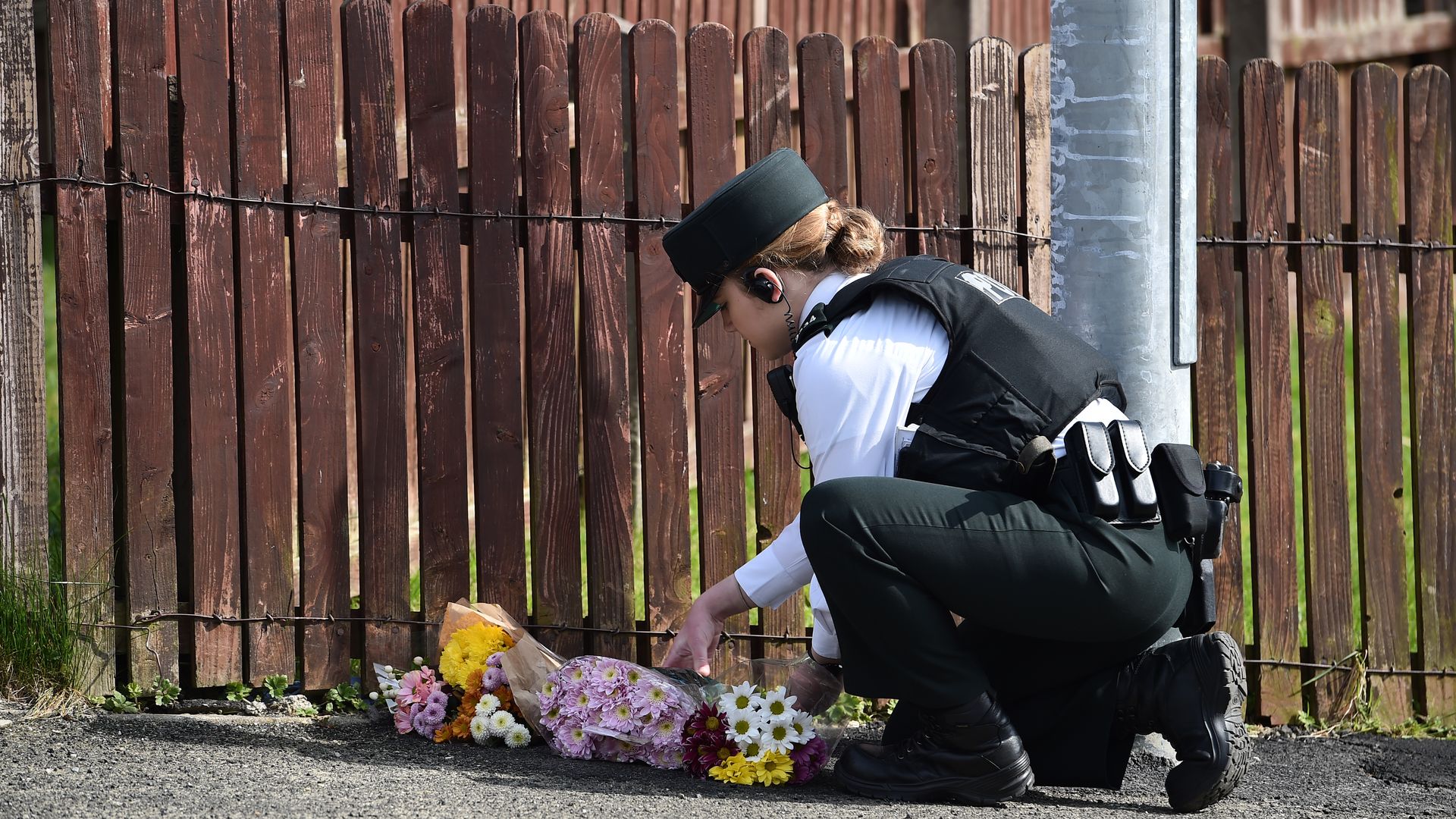 Photo of police woman at memrial scene of LyraMcKee
