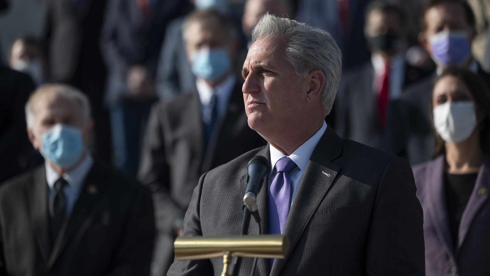 House Minority Leader Kevin McCarthy looks on during a news conference outside the U.S. Capitol.