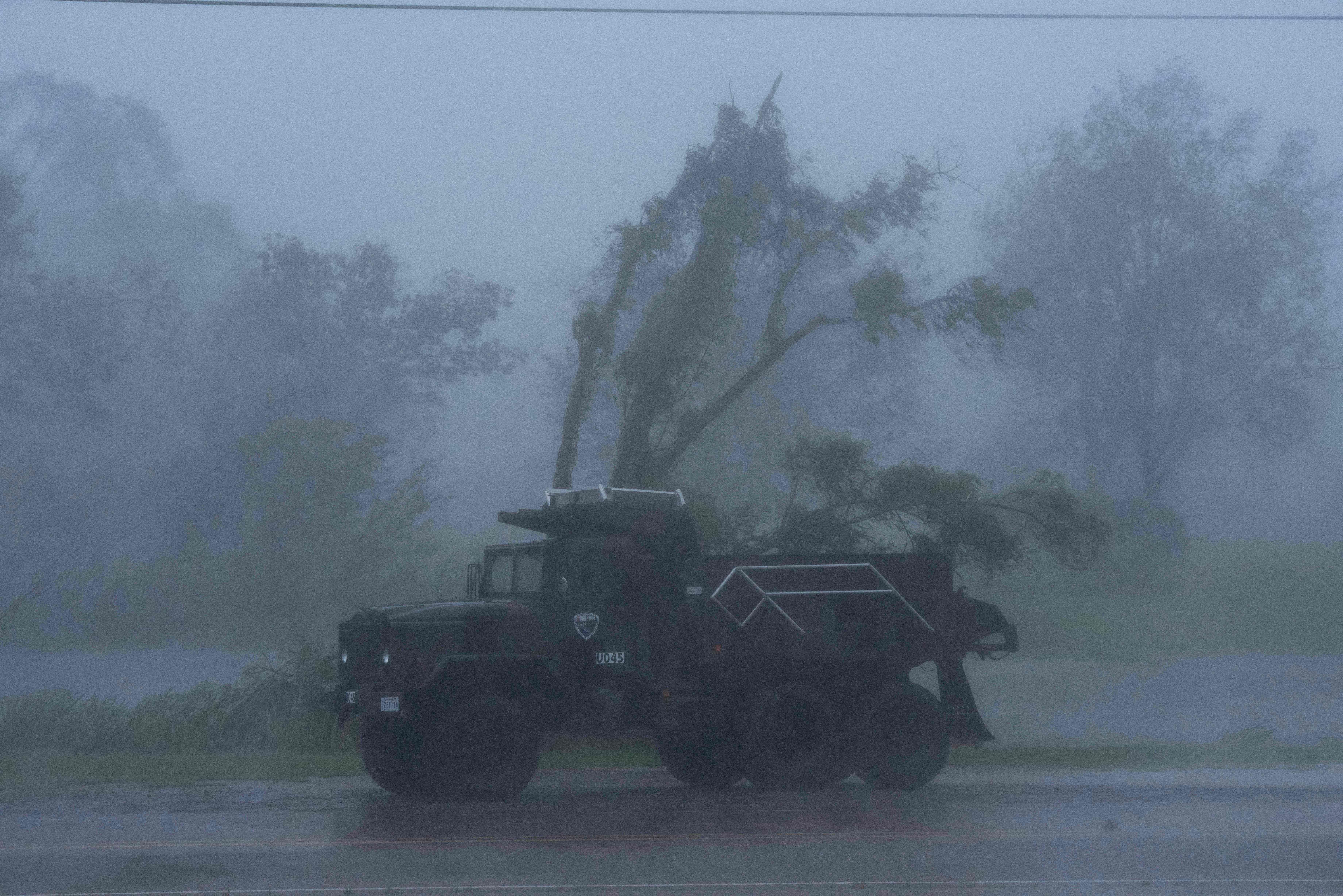 A truck is seen in heavy winds and rain from hurricane Ida in Bourg, Louisiana. 