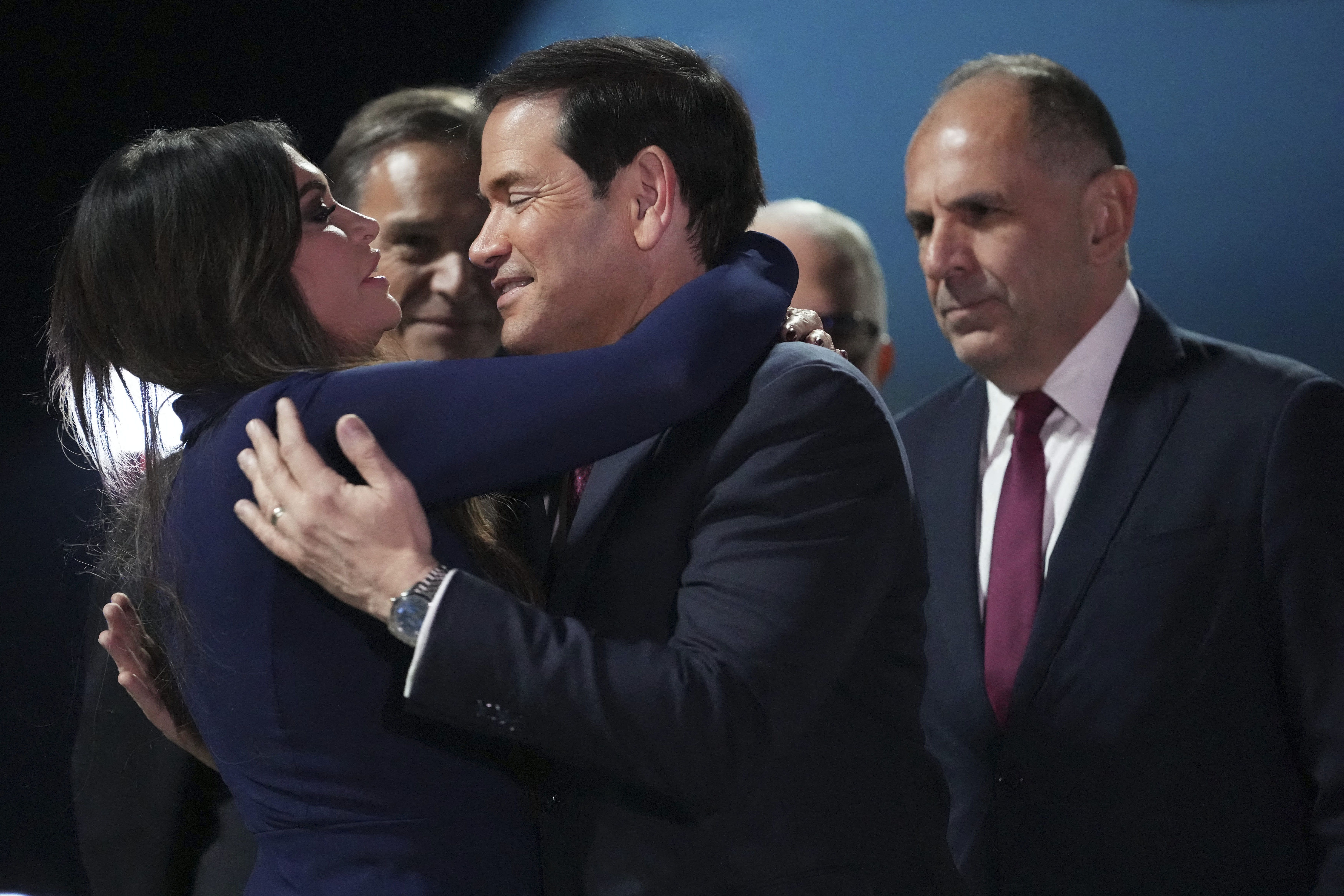 Ambassador to Greece Kimberly Guilfoyle (L) greets US Secretary of State Marco Rubio (C), next to Greek Foreign Minister George Gerapetritis (R), upon his arrival at Athens' Eleftherios Venizelos international airport, near Athens, for an official visit in Greece, on October 6, 2026. (Photo by Mark