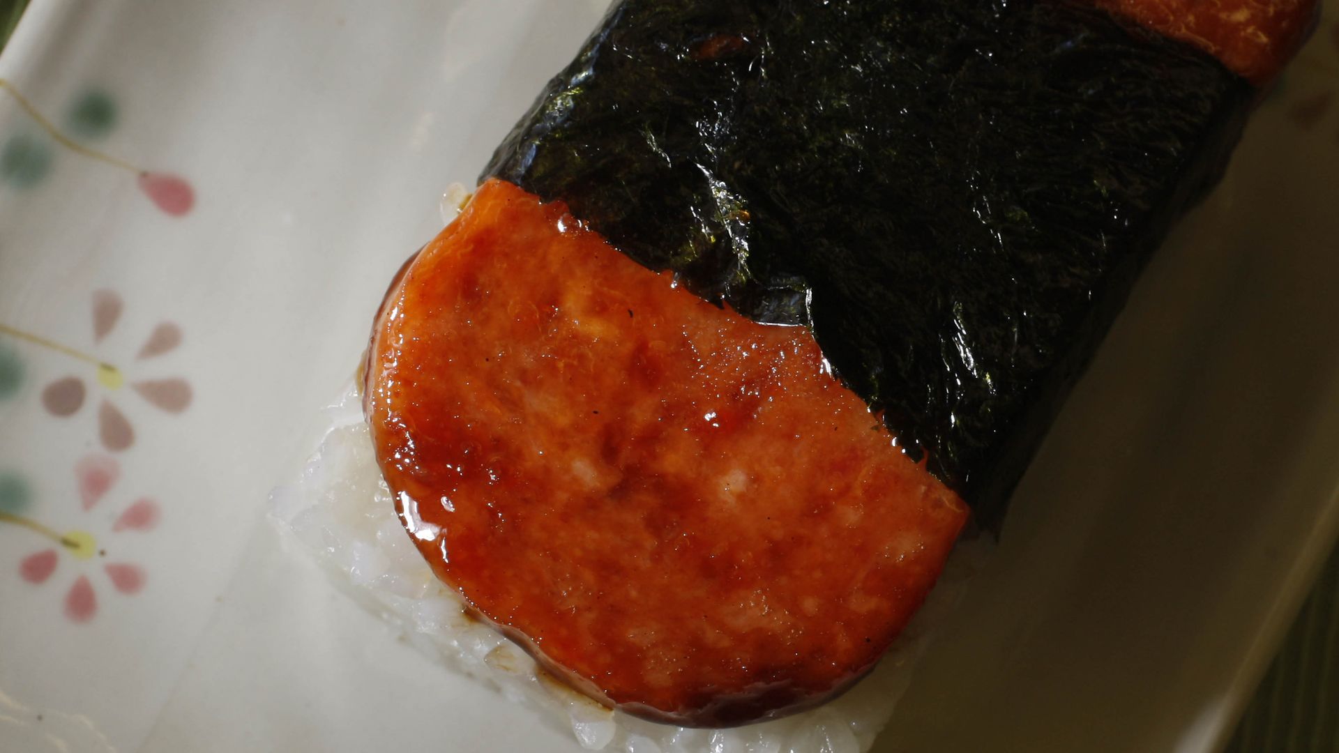 Photo of a spam musubi sitting on a plate