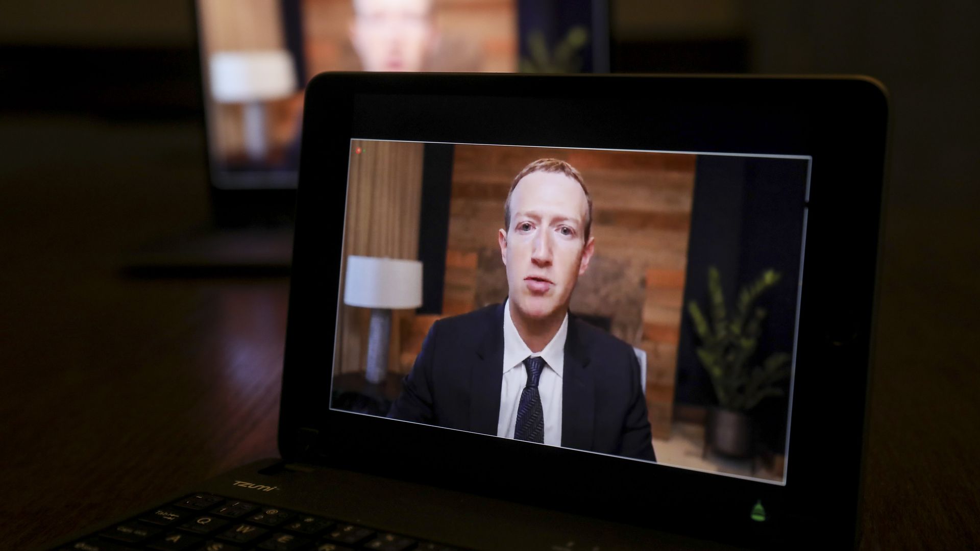Mark Zuckerberg, Facebook CEO, speaks virtually at  a House hearing on a laptop computer in Tiskilwa, Illinois, U.S., on Thursday, March 25