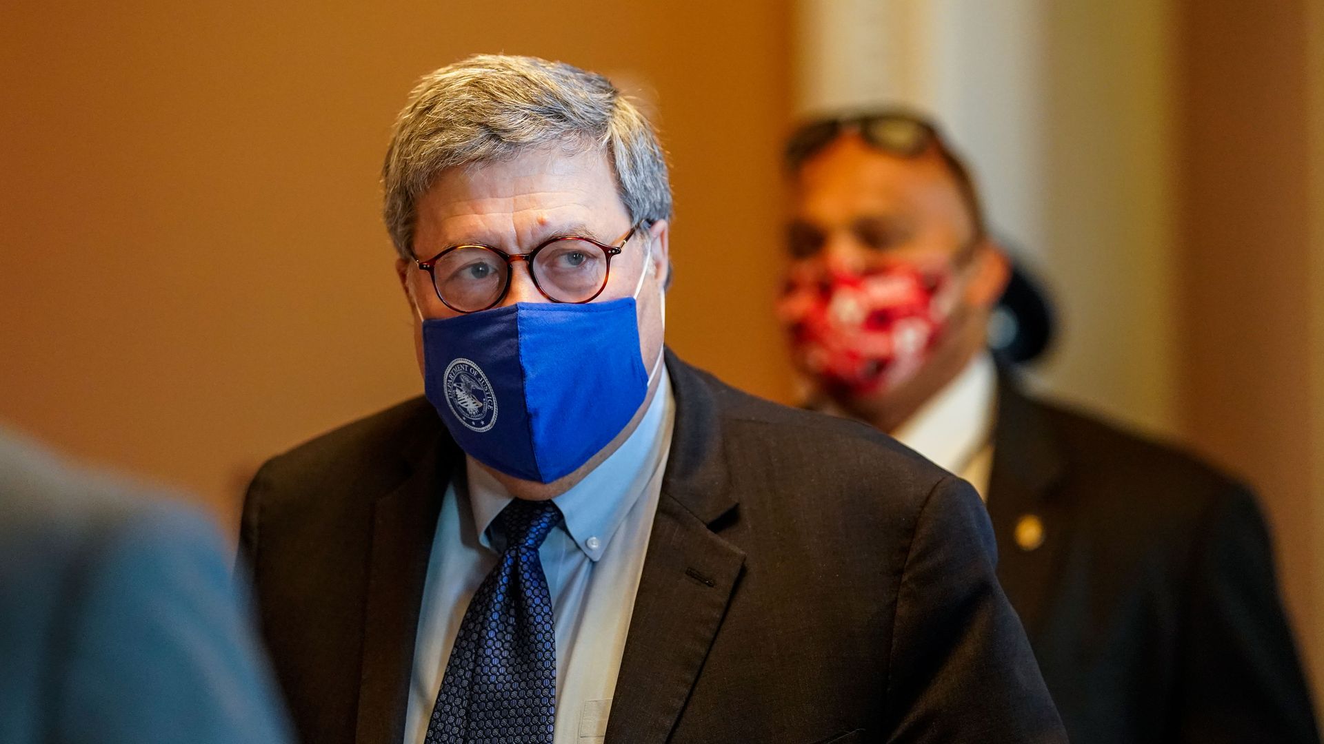 Photo of a masked William Barr