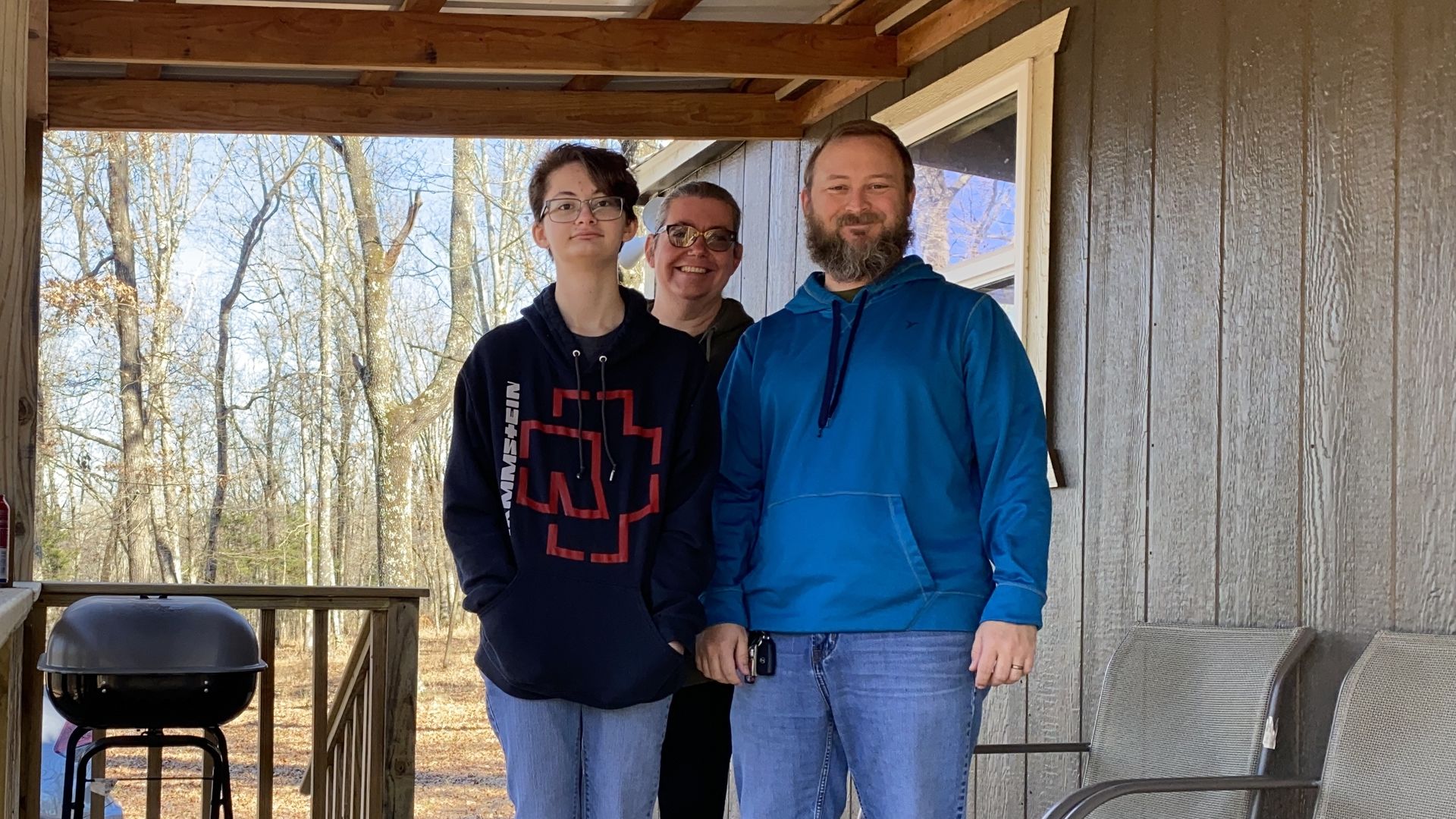 The Spurrier family stands on their front porch 