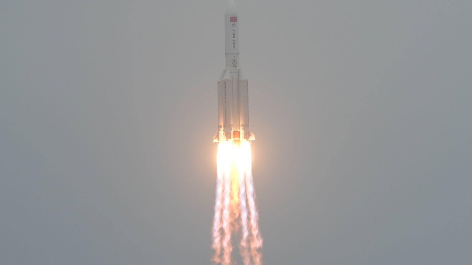  The Long March-5B Y2 rocket, carrying the Tianhe module, blasts off from the Wenchang Spacecraft Launch Site in south China's Hainan Province, April 29, 2021.