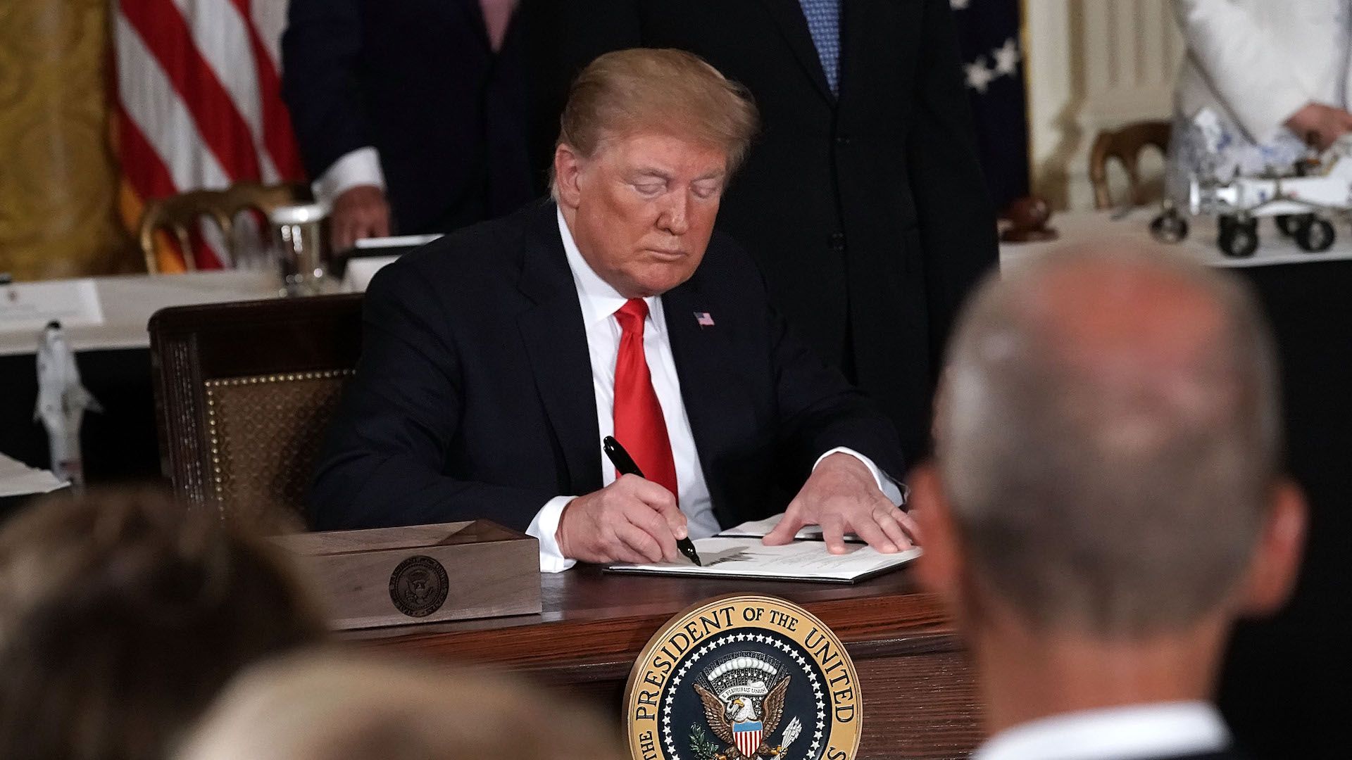 President Donald Trump signs an executive order on the Space Force in June.