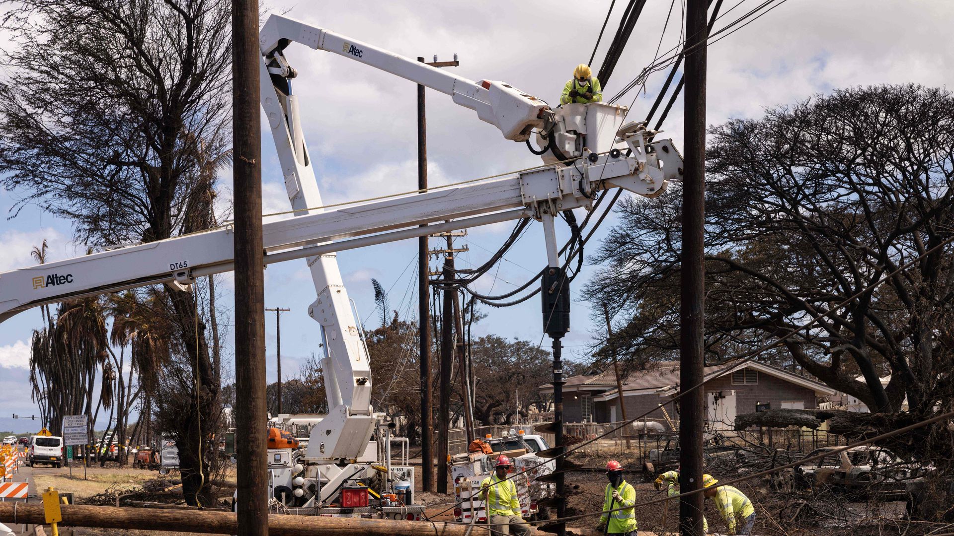 Hawaii workers restore electric poles