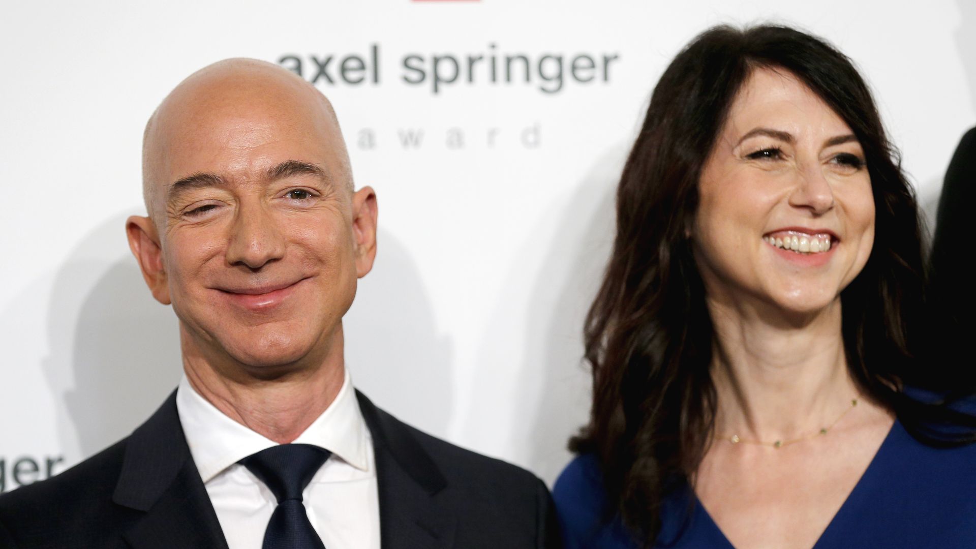 Jeff Bezos stands next to his wife MacKenzie