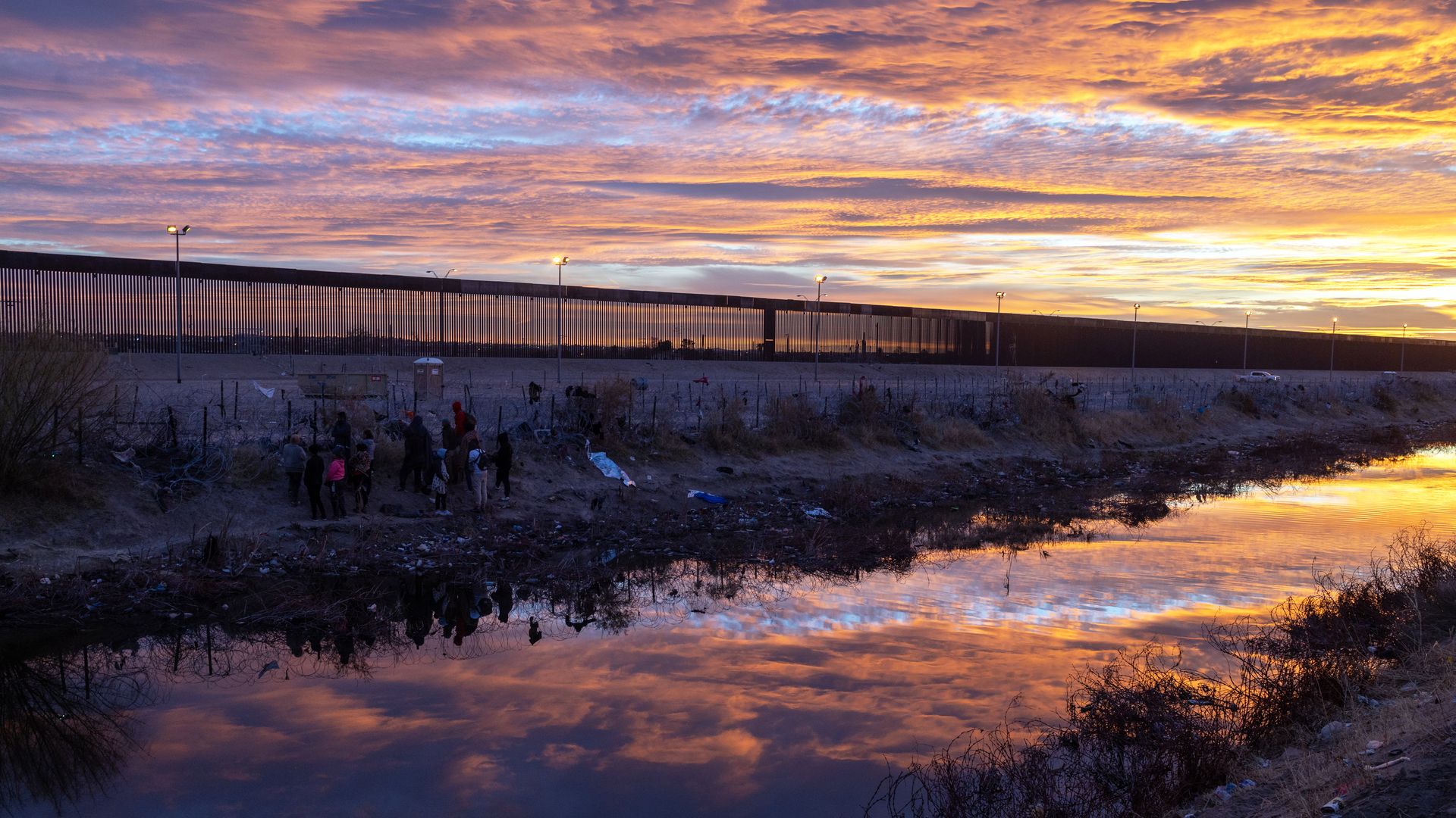 Migrants attempt to cross the border