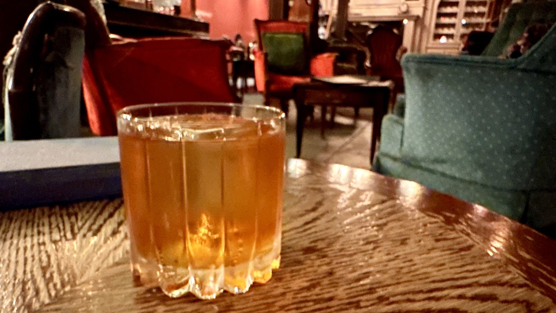 A photo of a cocktail in a library setting