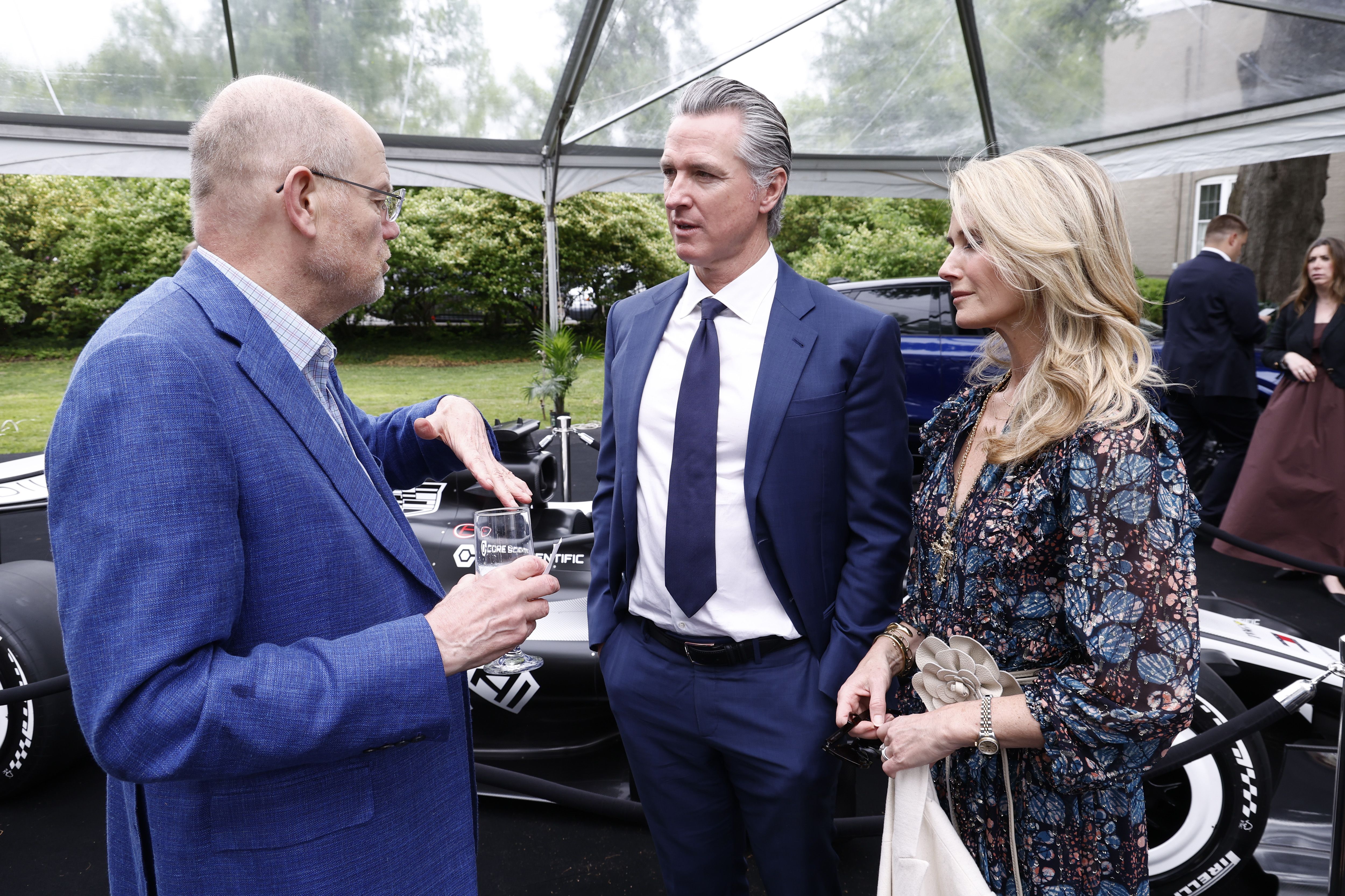 Gavin and Jennifer Newsom speak with CNN CEO Mark Thompson outside the Garden Brunch
