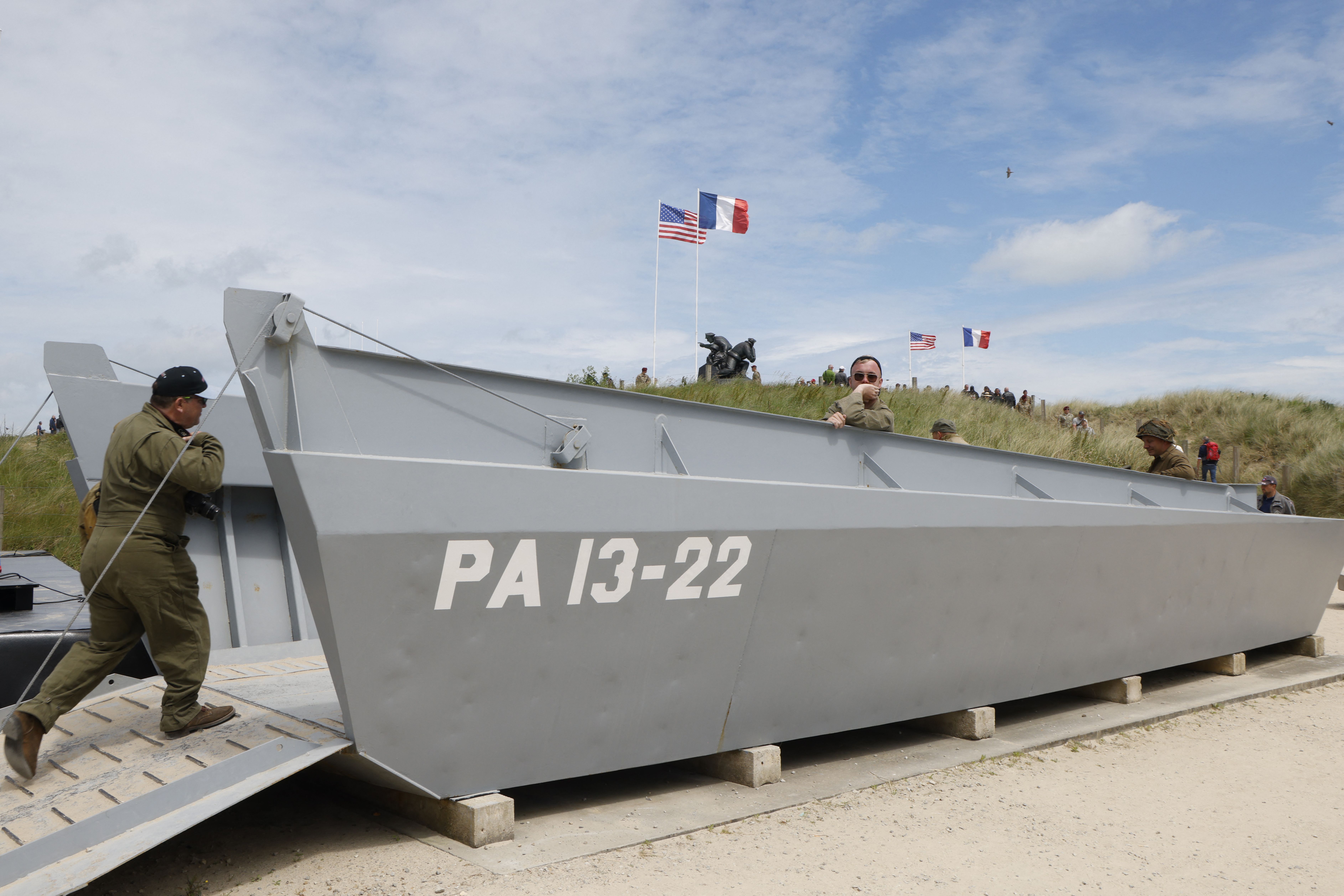 Photo shows someone in a Higgins boat in Normandy.