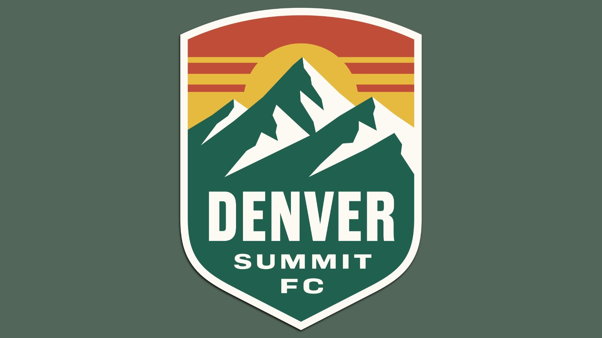 A crest with the words DENVER SUMMIT FC with a silhouette of mountains and a sun. 