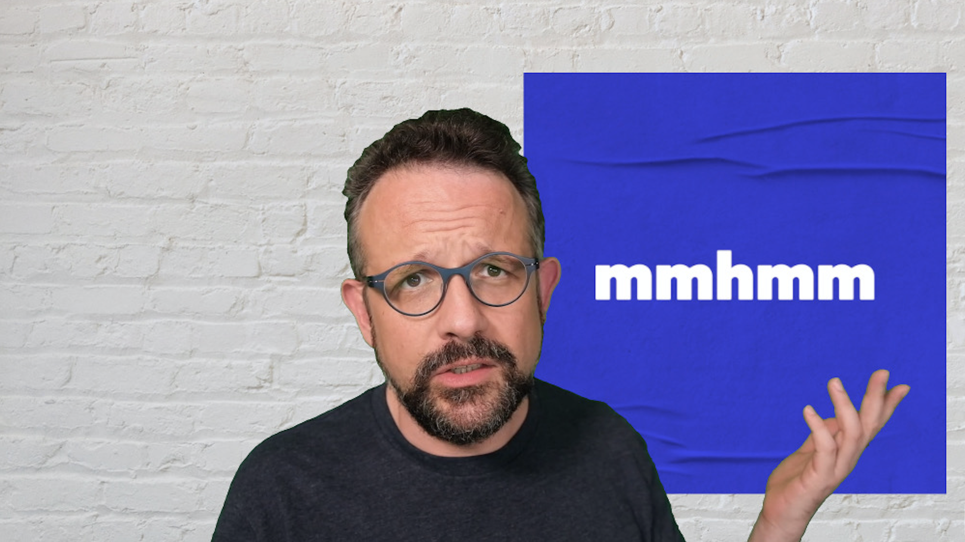 Mhmm CEO Phil Libin next to a sign with the company's logo
