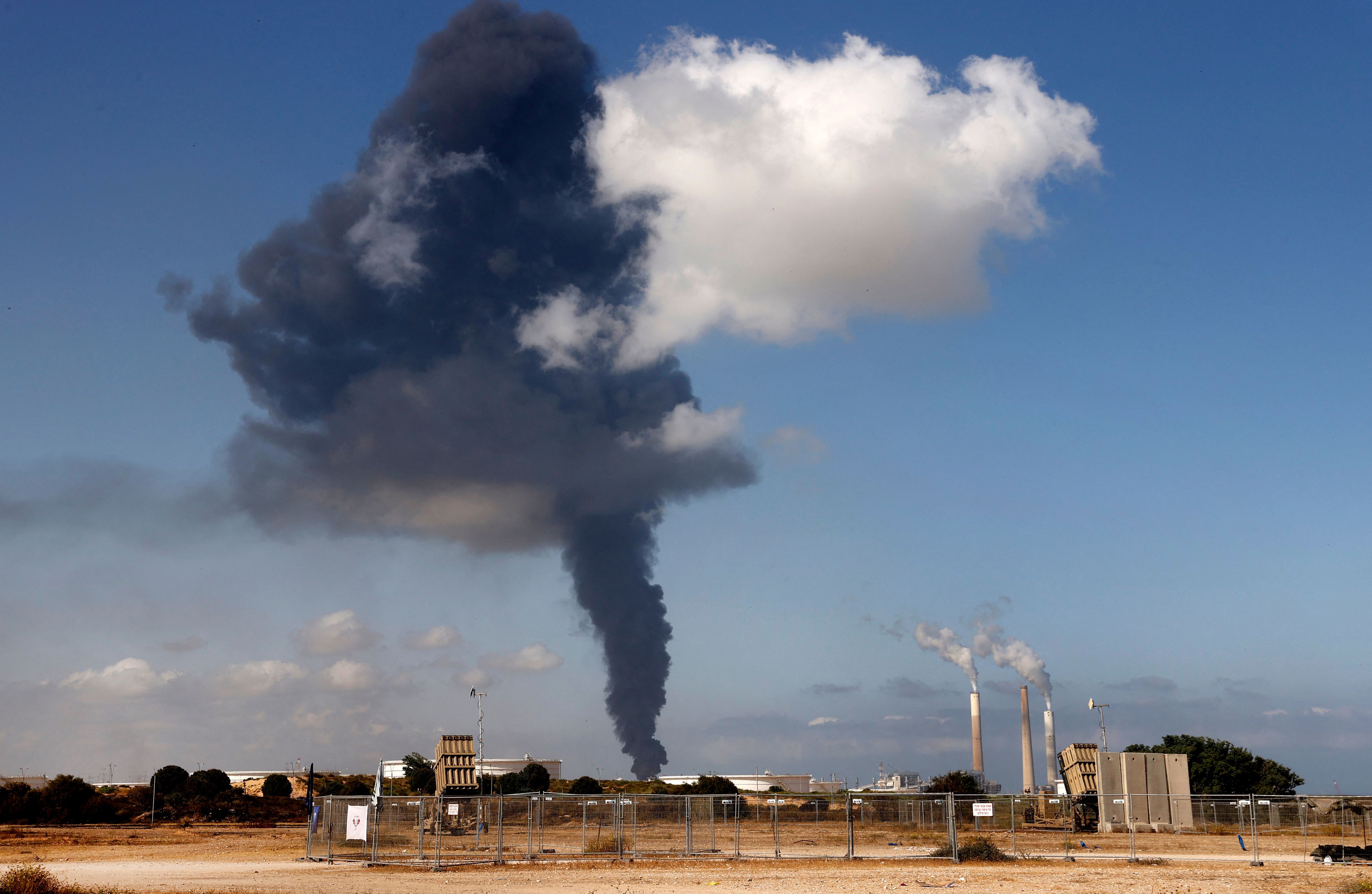  Smoke billows on May 12, 2021 at Ashkelon's refinery, hit by Hamas rockets the previous day in the southern Israeli city, near the Gaza Strip. 