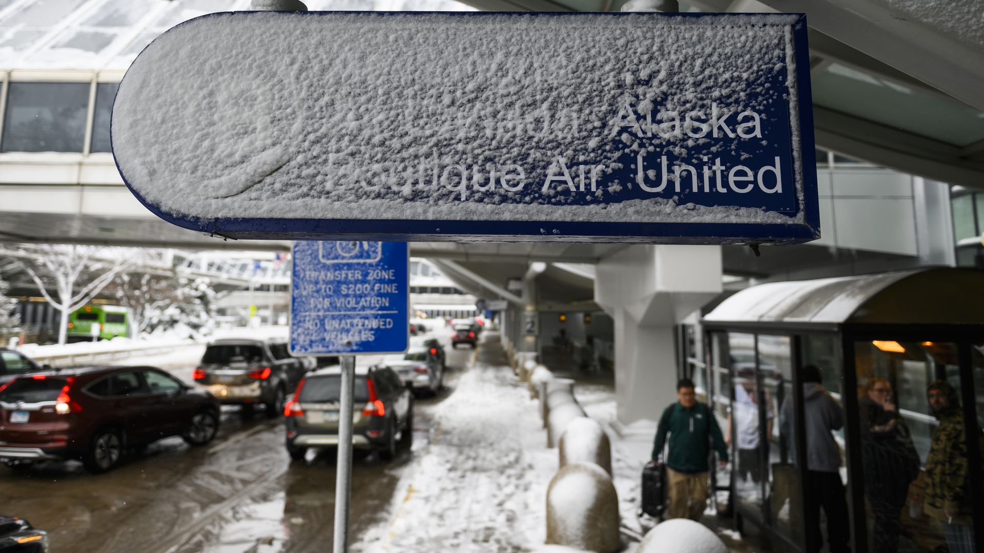 Signage outside Minneapolis-St. Paul International Airport is caked in snow after a blizzard struck overnight on November 27, 2019 in Bloomington, Minnesota.