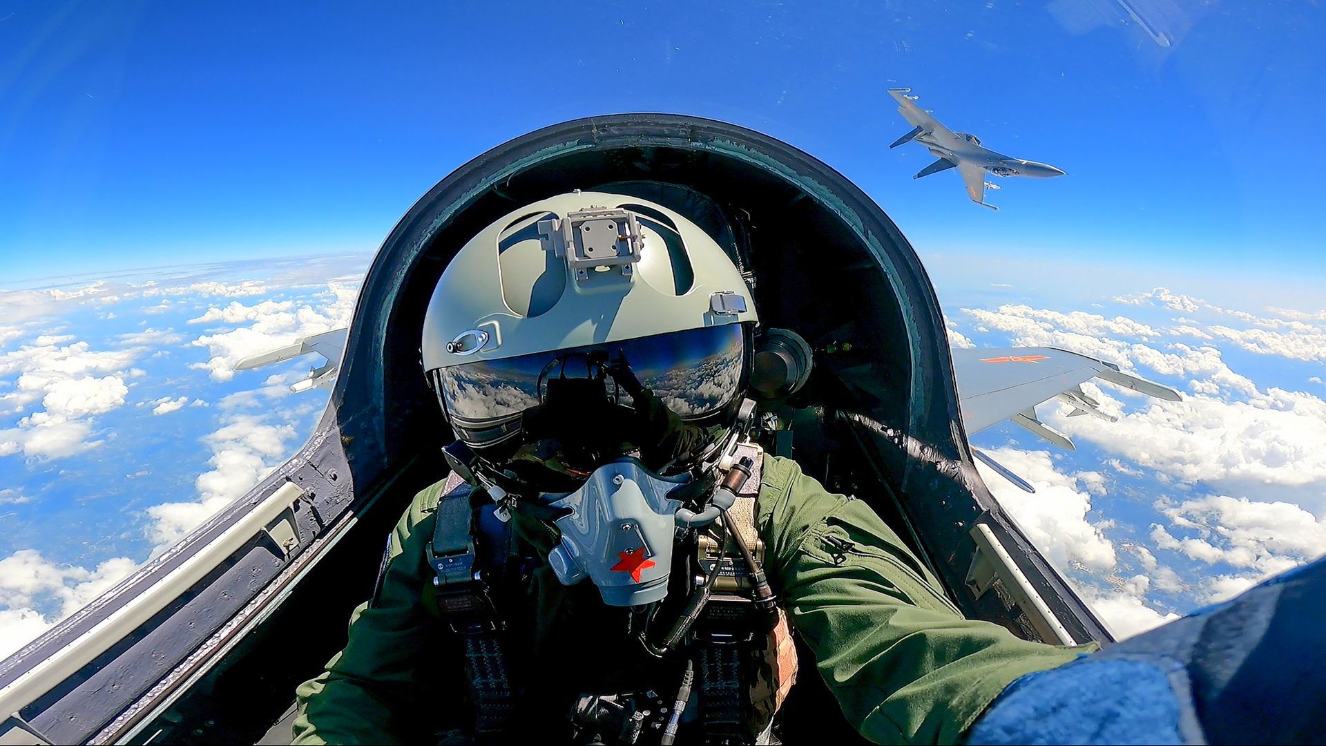 A pilot flying a war plane