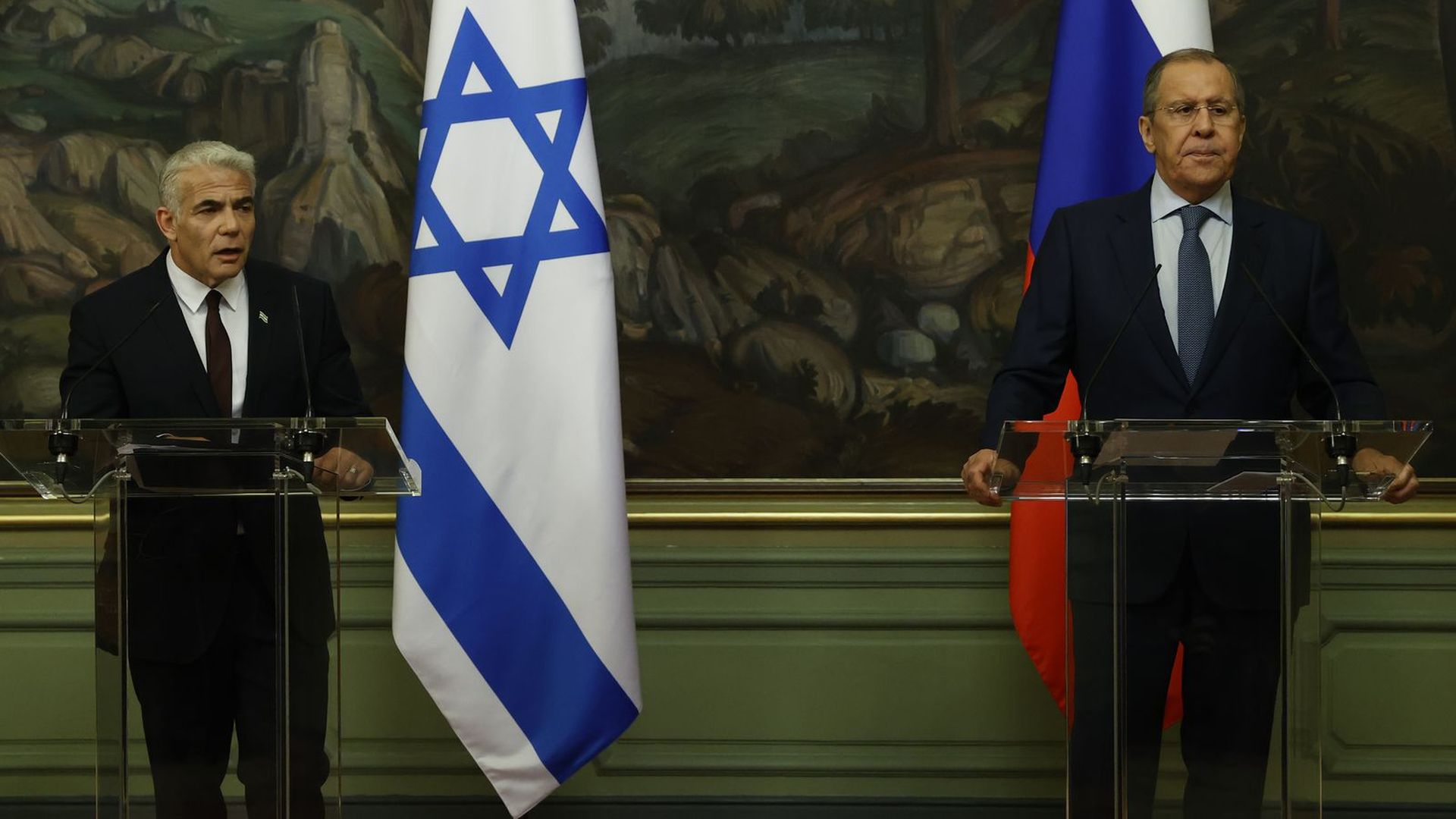 Israeli Foreign Minister Yair Lapid (left) and Russian Foreign Minister Sergei Lavrov hold a press conference following a meeting in Moscow on Sept. 9, 2021.