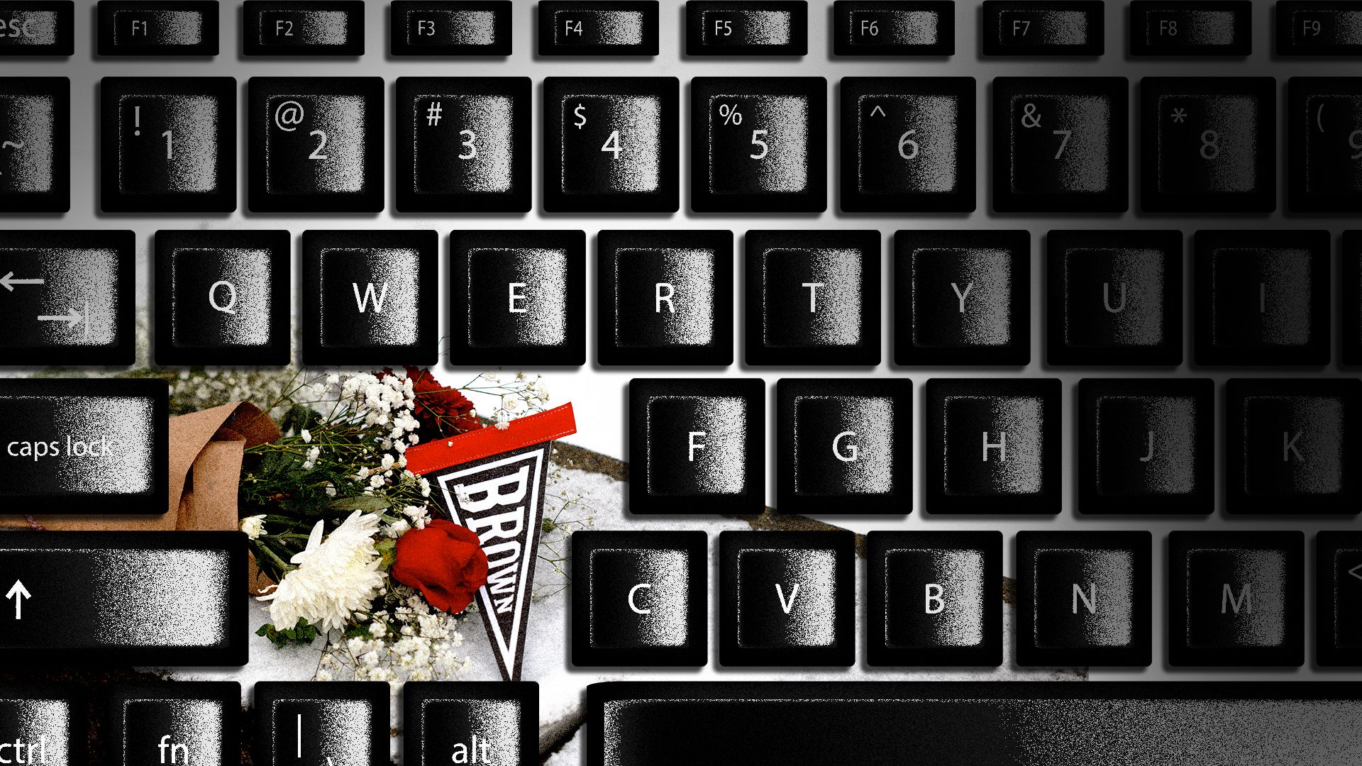 Photo illustration of flowers and a Brown University pennant surrounded by a computer keyboard.