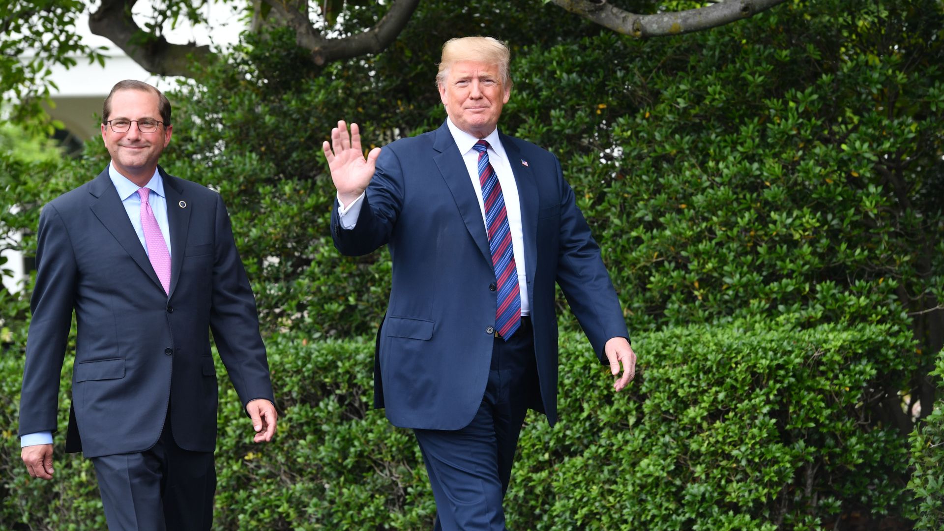Trump walking with HHS secretary Alex Azar