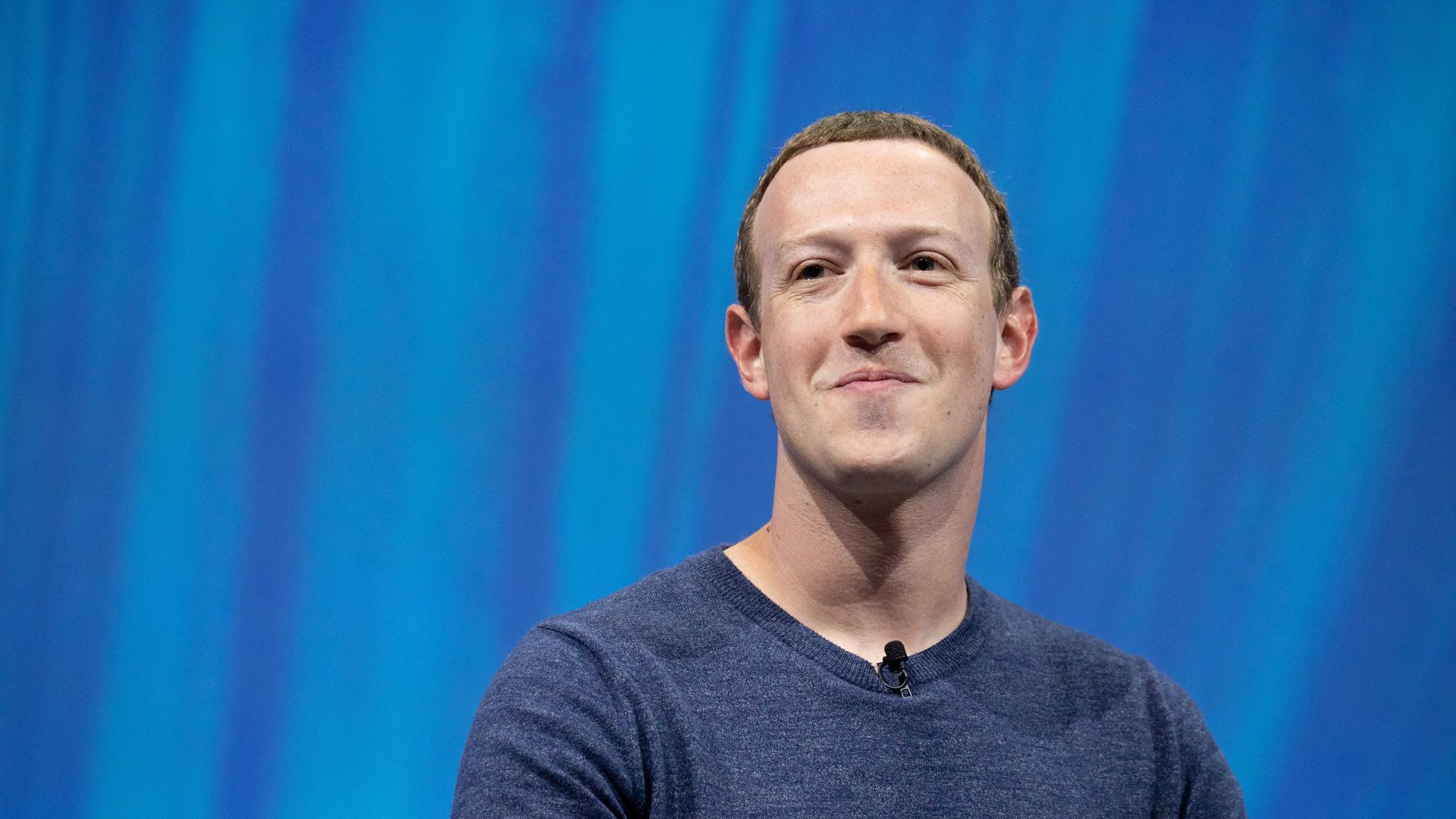 Facebook CEO Mark Zuckerberg with a half-smile on his face