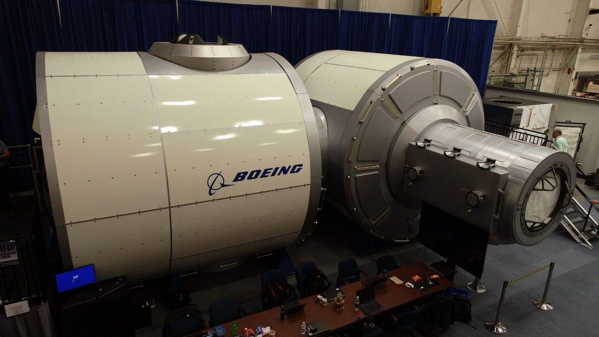 In this image, the Boeing logo is seen on the side of a large white circular gateway demonstrator.