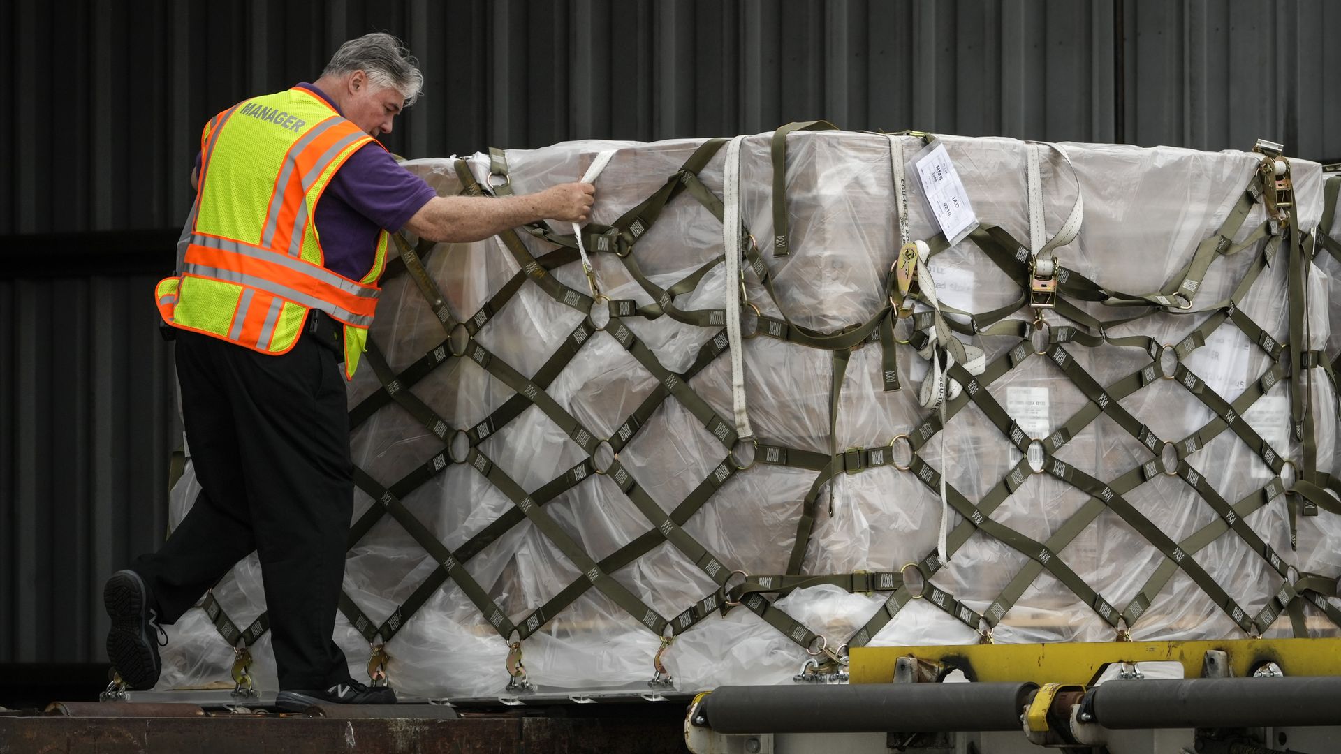 A person unloading a pallet of baby formula from an airplane in Dulles, Virginia, on May 25.