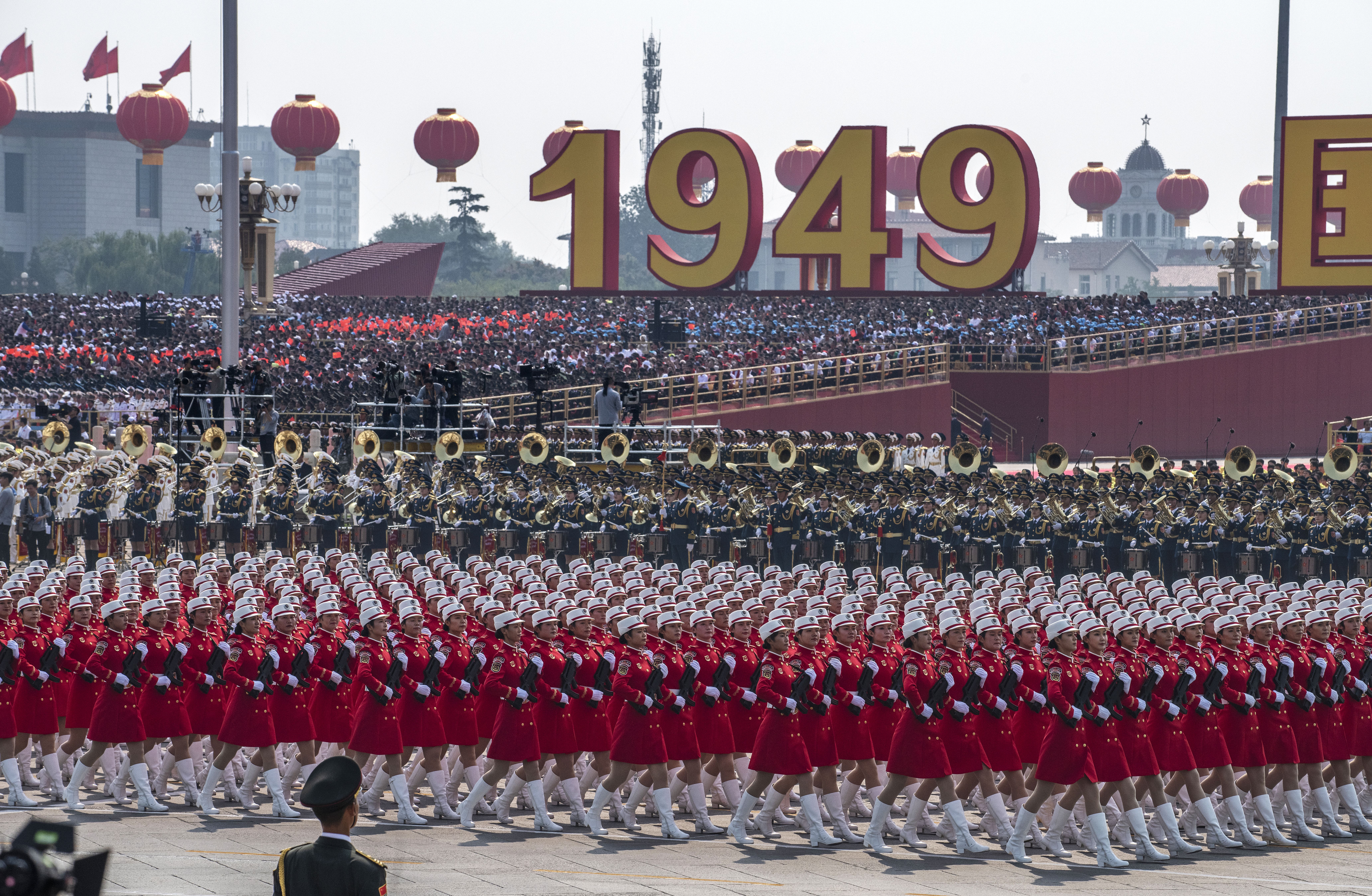 Chinese female soldiers march in in formation during a parade to celebrate the 70th Anniversary of the founding of the People's Republic of China