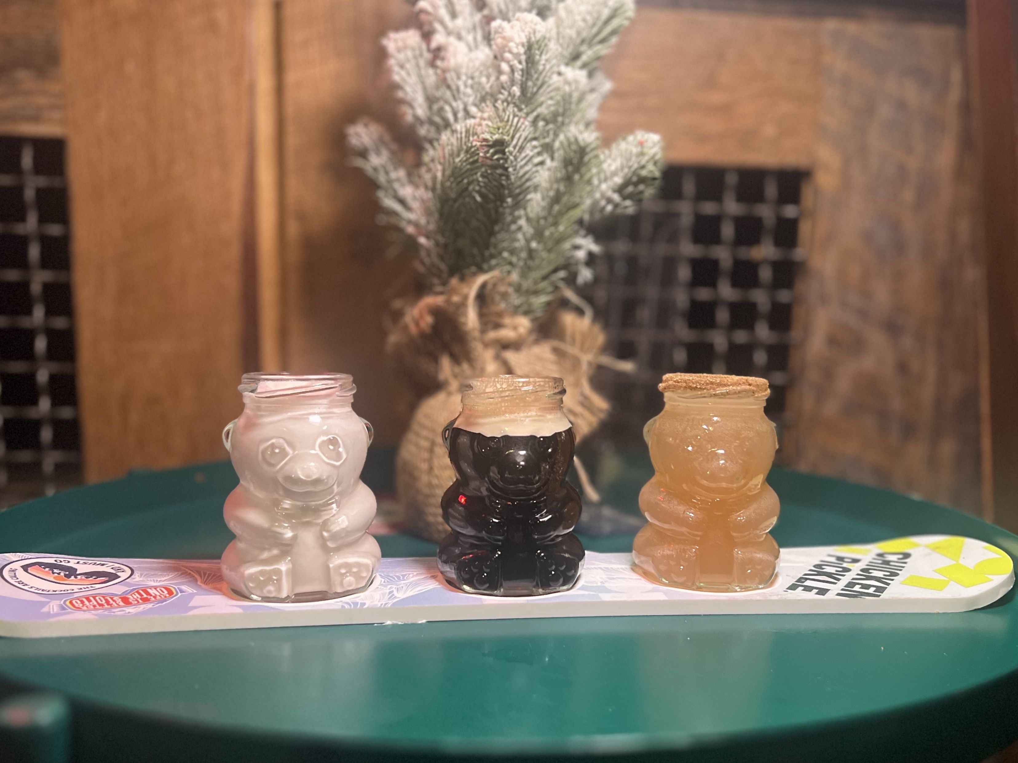 Three teddy bear-sized shot glasses.