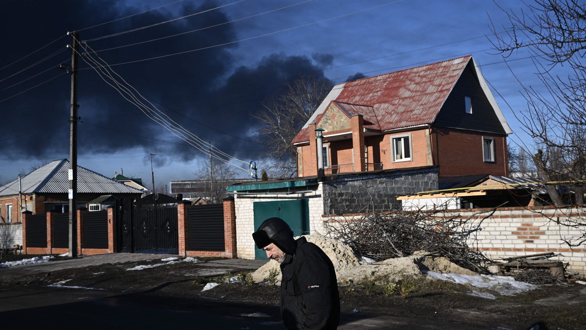 Black smoke rises from a military airport in Chuguyev near Kharkiv on February 24, 2022. 