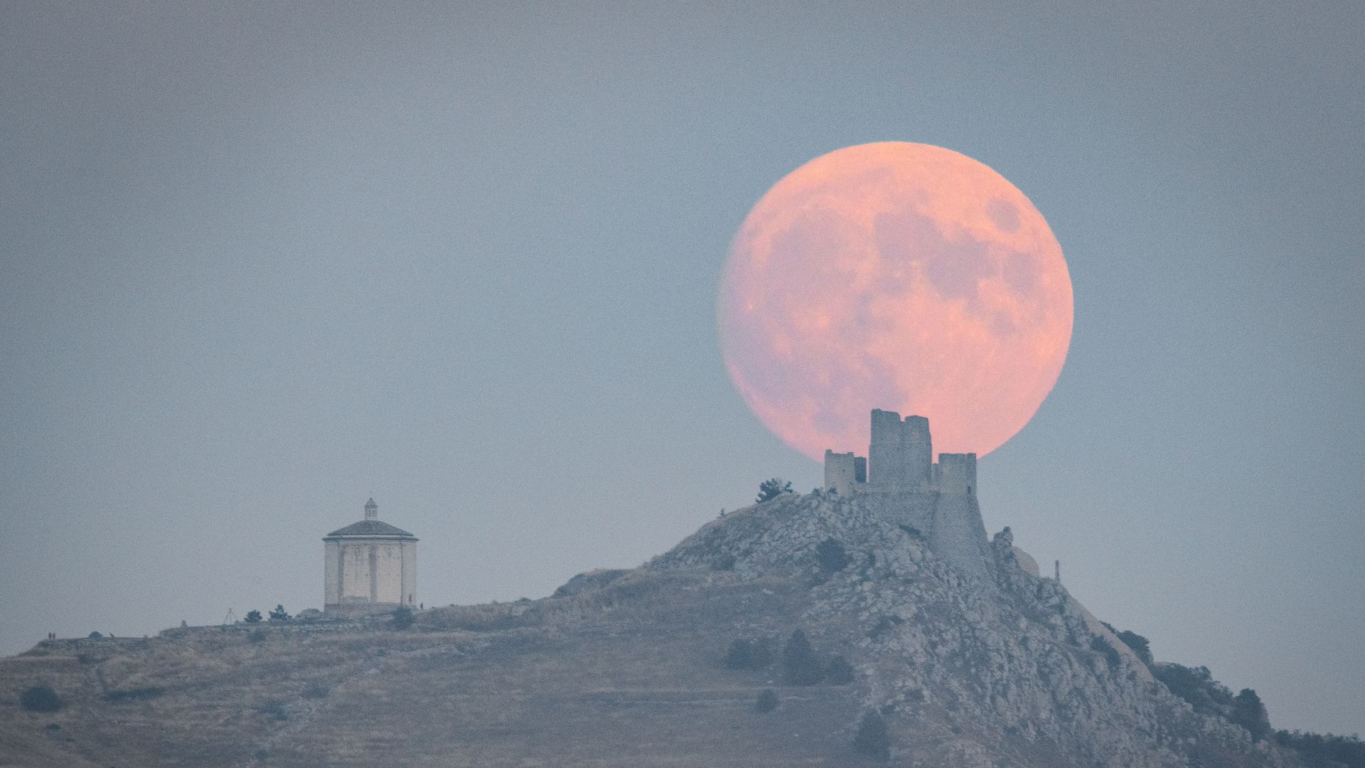 moon rising over landscape