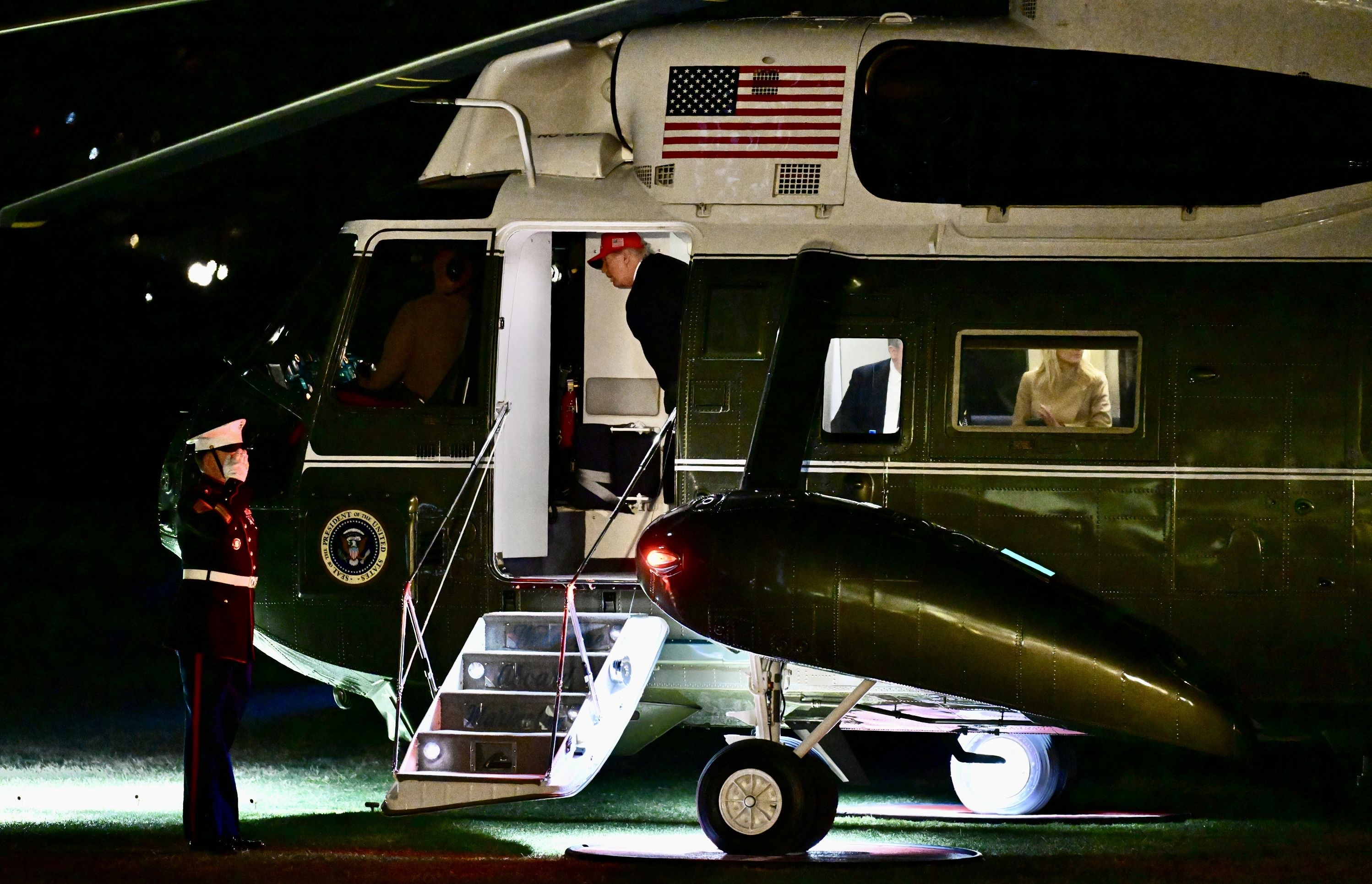 President Trump talks to the pilots of Marine One after landing at the White House last night.