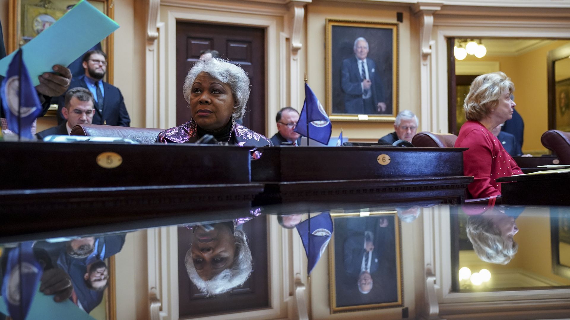 Louise Lucas (C), member of the Virginia Legislative Black Caucus, listens to the proceedings on the Senate floor at the Virginia State Capitol, February 7, 2019 in Richmond, Virginia. 