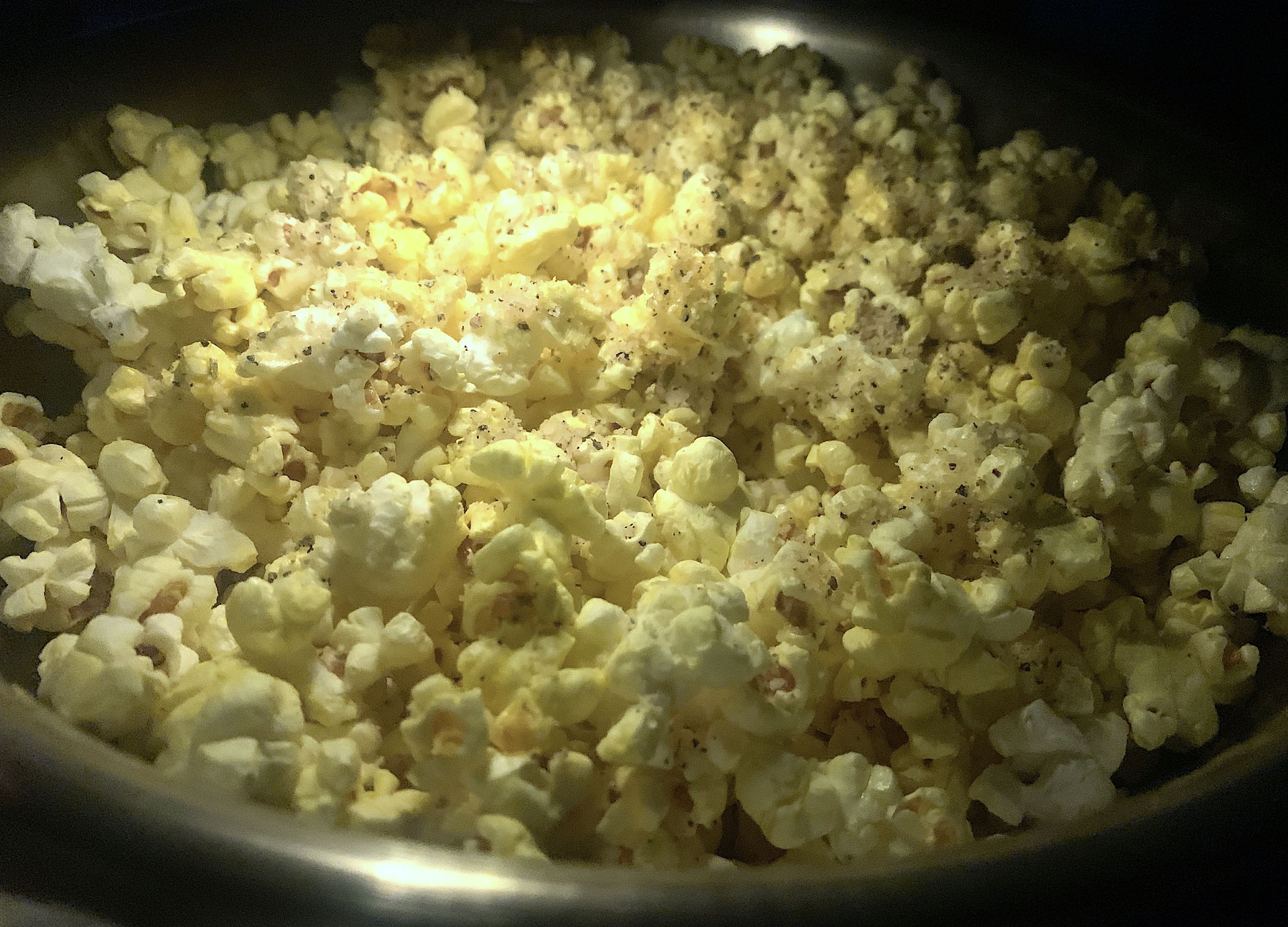 Yellow and white popcorn with spices.