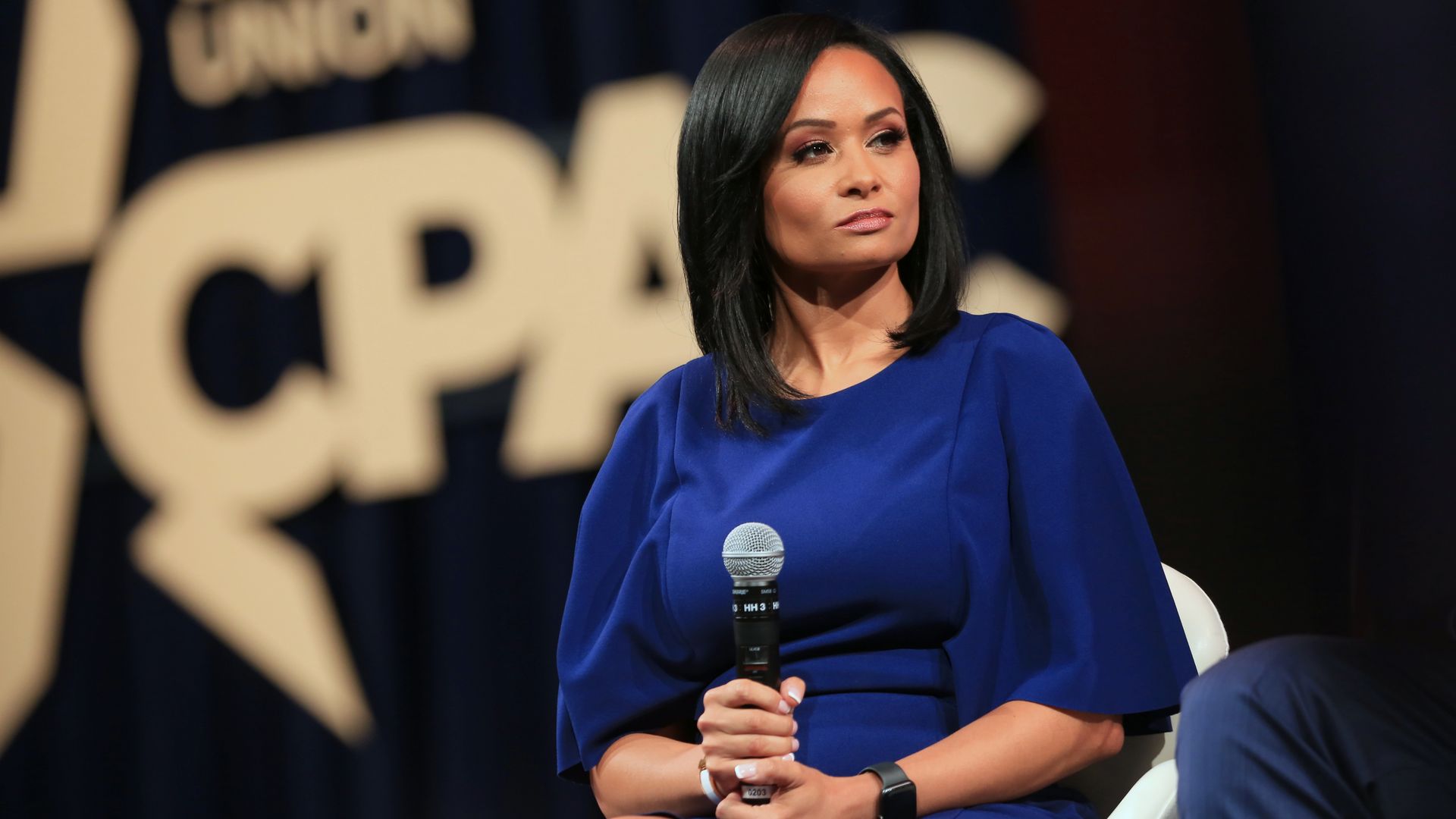 Katrina Pierson holding a microphone
