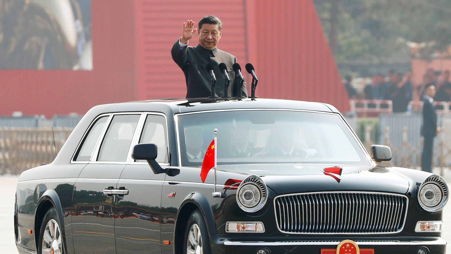 Xi riding in a car at military parade